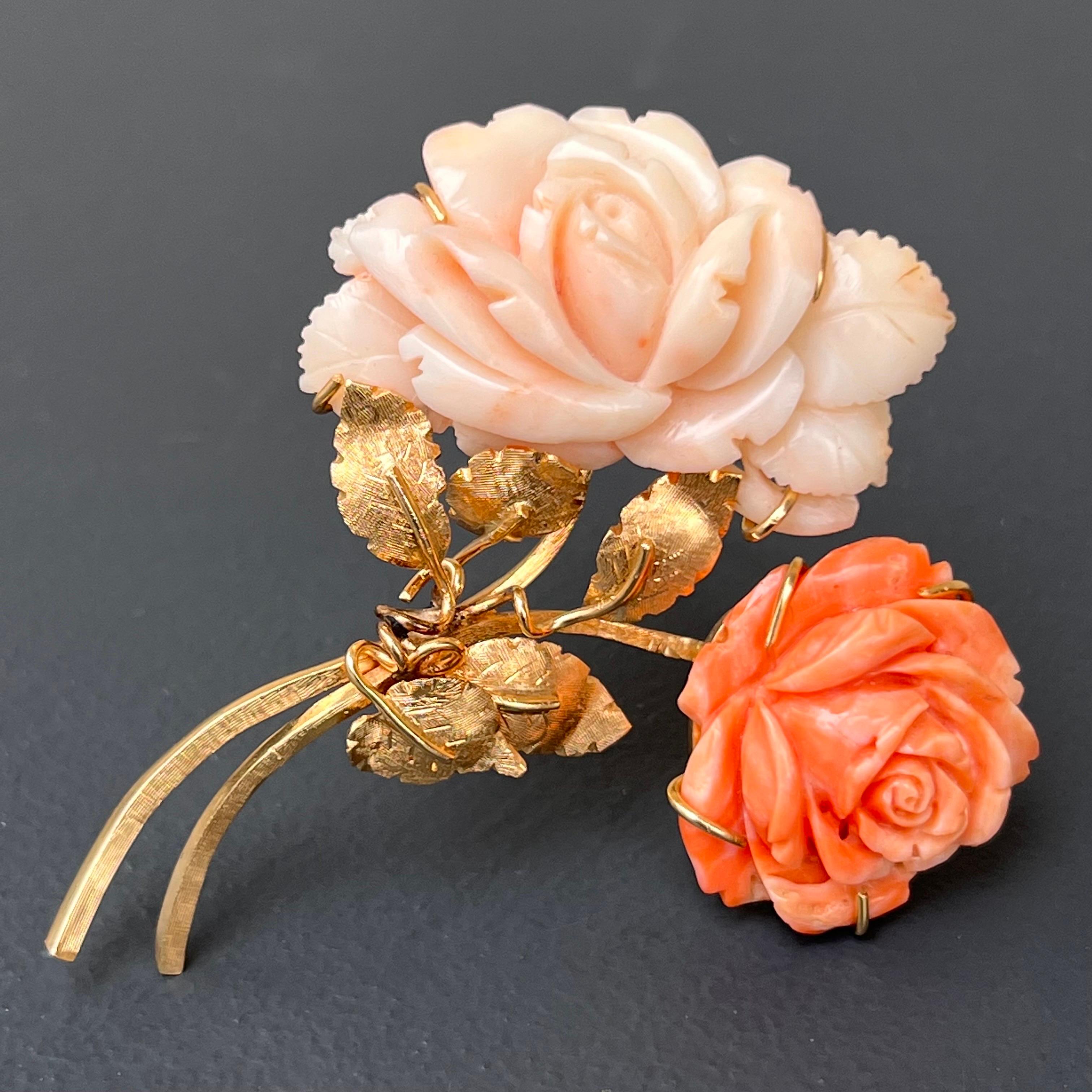 Large finely carved coral floral pin brooch with two colored deeply carved rose flower set in 14kt solid textured gold . back has rollover clasp .
Faded 14kt mark on backside .

Materials:
14kt solid gold
salmon and angel skin carved