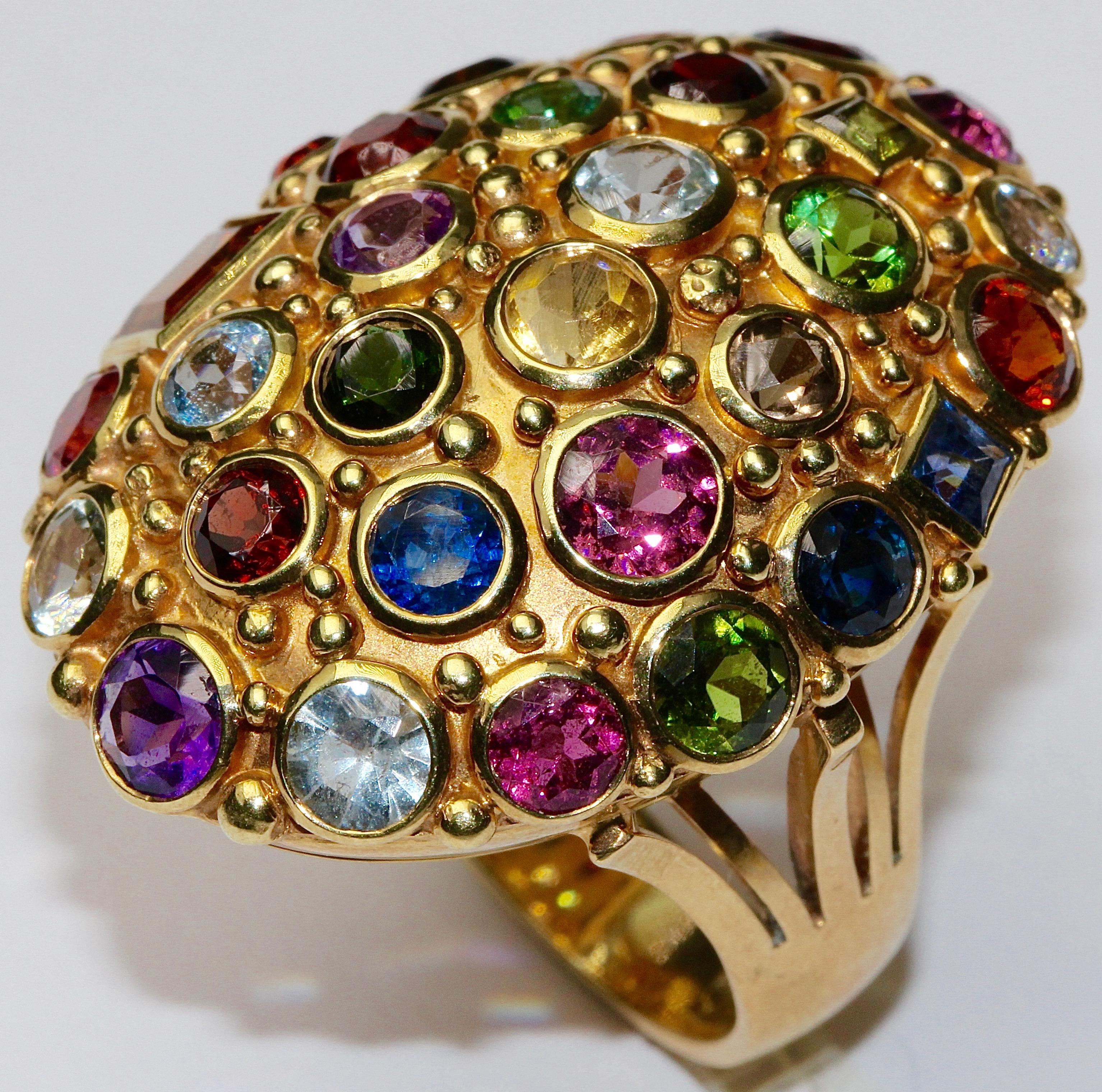 Beautiful and very fancy ladies cocktail ring. 14ct gold, hallmarked.
The ring is studded with several gemstones, e.g. with aquamarine, tourmaline, amethyst, smoky topaz, citrine, ruby, sapphire, blue topaz.

Finest goldsmith work.
