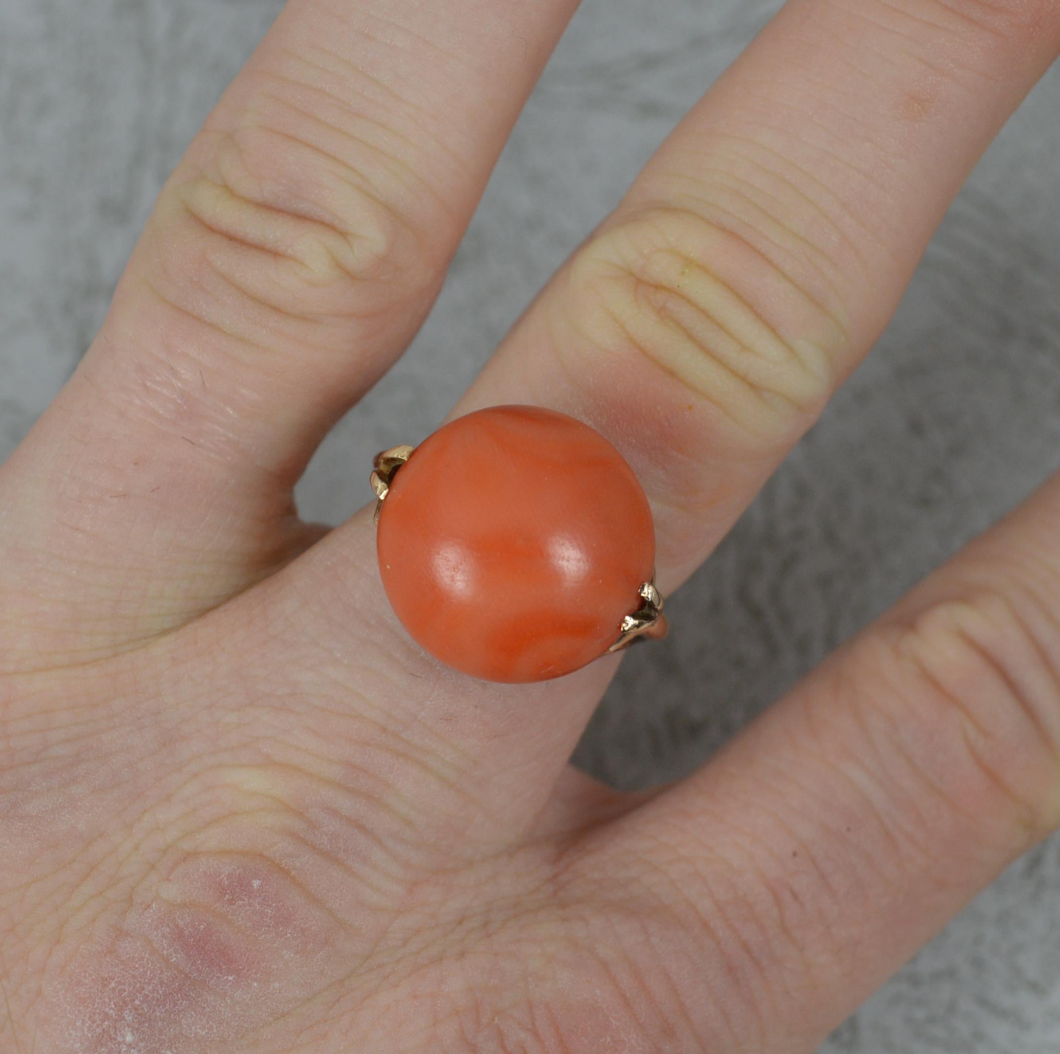 A large vintage statement ring.
Solid 14 carat gold example with double claw settings.
Set with a single, circular shaped piece of coral to centre. 16mm x 16mm x 11mm coral. 

CONDITION ; Excellent. A strong, solid band. Issue free diamonds, well