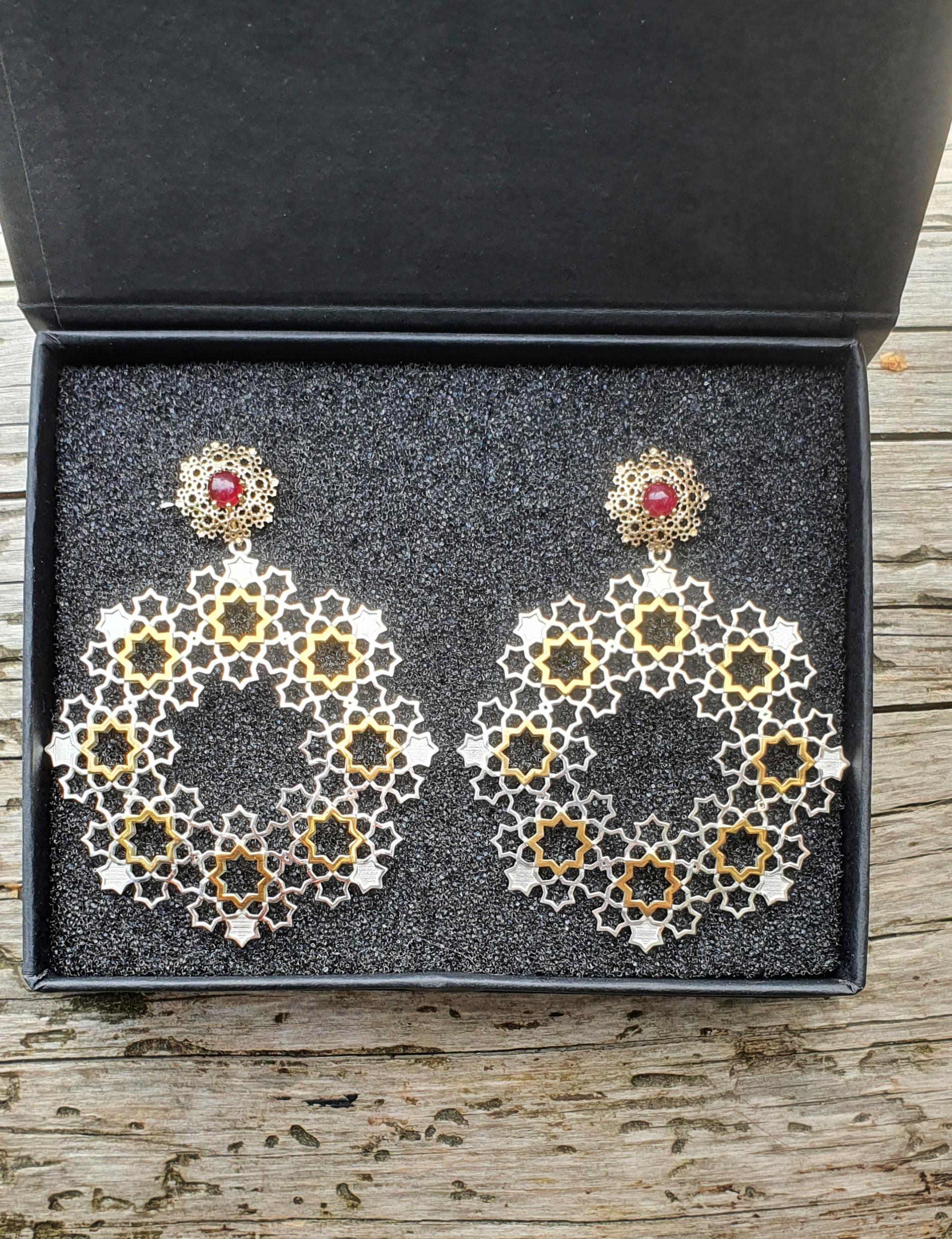 Large 14k gold and 925 silver earrings studs. 

Genuine ruby earrings. Two Parts Earrings. Transformer studs. Two metal earrings.

Earrings made of two materials: 14 kt yellow gold and 925 purity silver.
Made of 14k yellow gold (upper part with