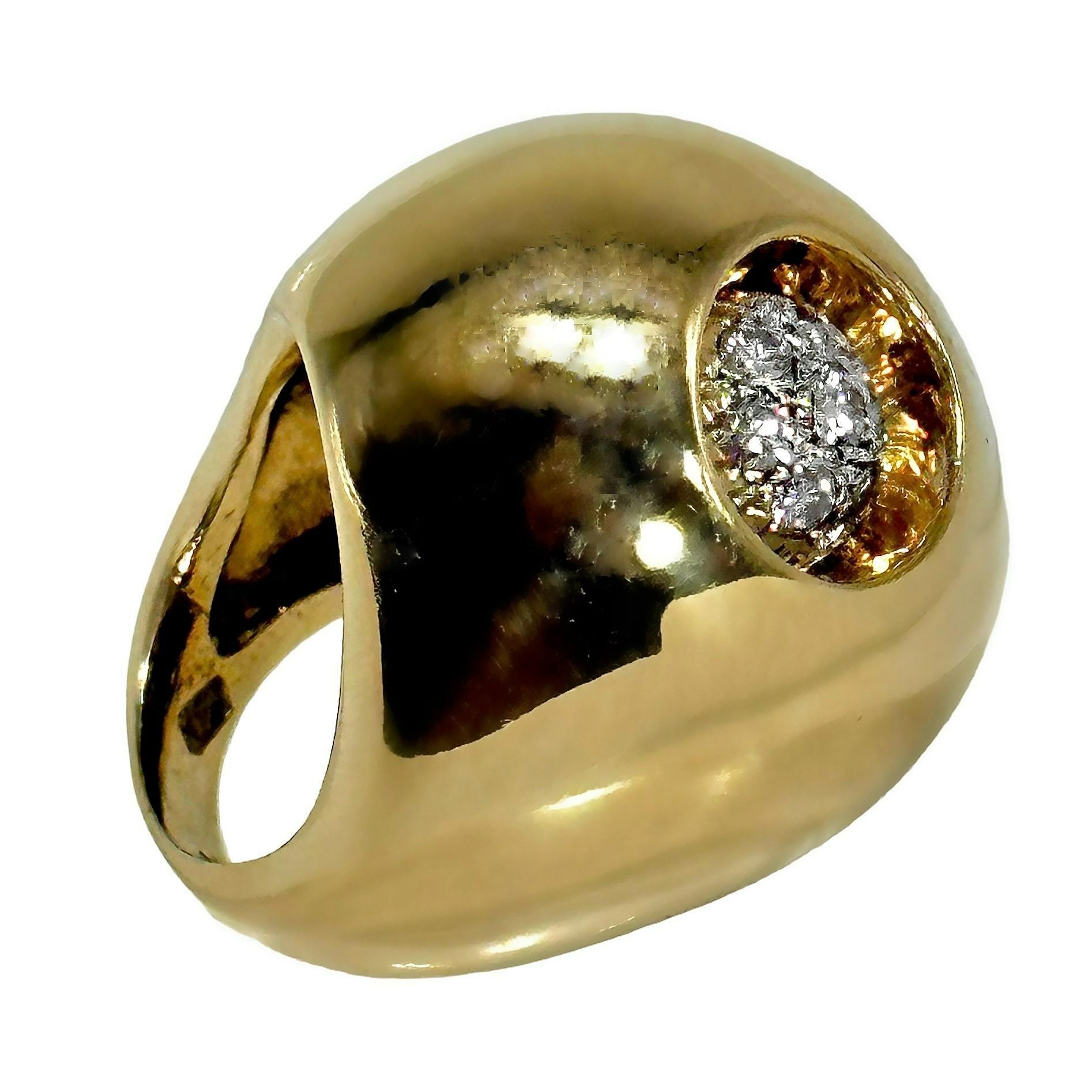 This powerful 14K yellow gold and diamond Modernist ring has a dome that rises more than 1/2 inch above the finger, a length of over 1 1/8 inches and width of 1 inch. Off to one side and deeply recessed is a grouping of eight brilliant cut diamonds