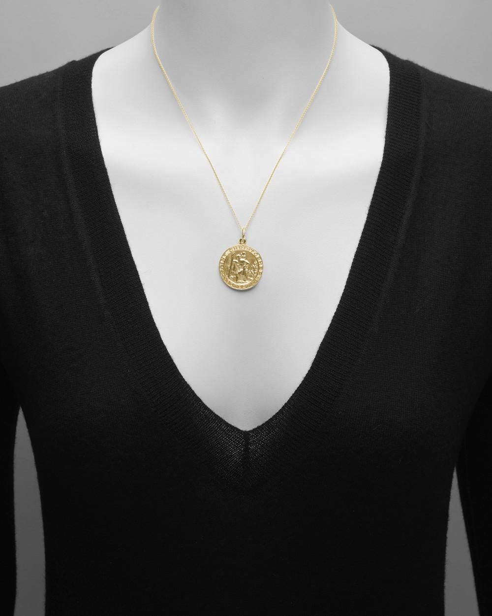 St. Christopher pendant in 14k yellow gold. Inscribed 