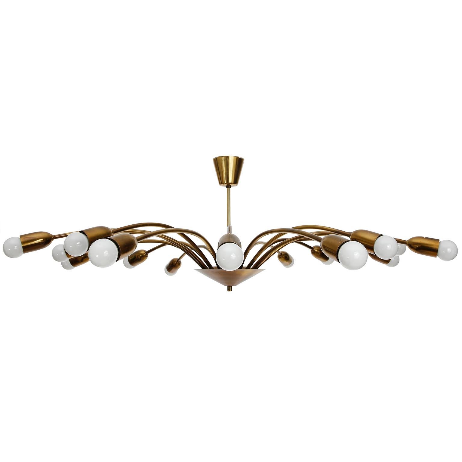 A large 16-arm brass spider light fixture manufactured in midcentury in 1960s.
The light is Italian or Austrian. Stilnovo or J.T. Kalmar made very similar lights. It is attributed to one of them.
This beautiful fixture is made of natural aged