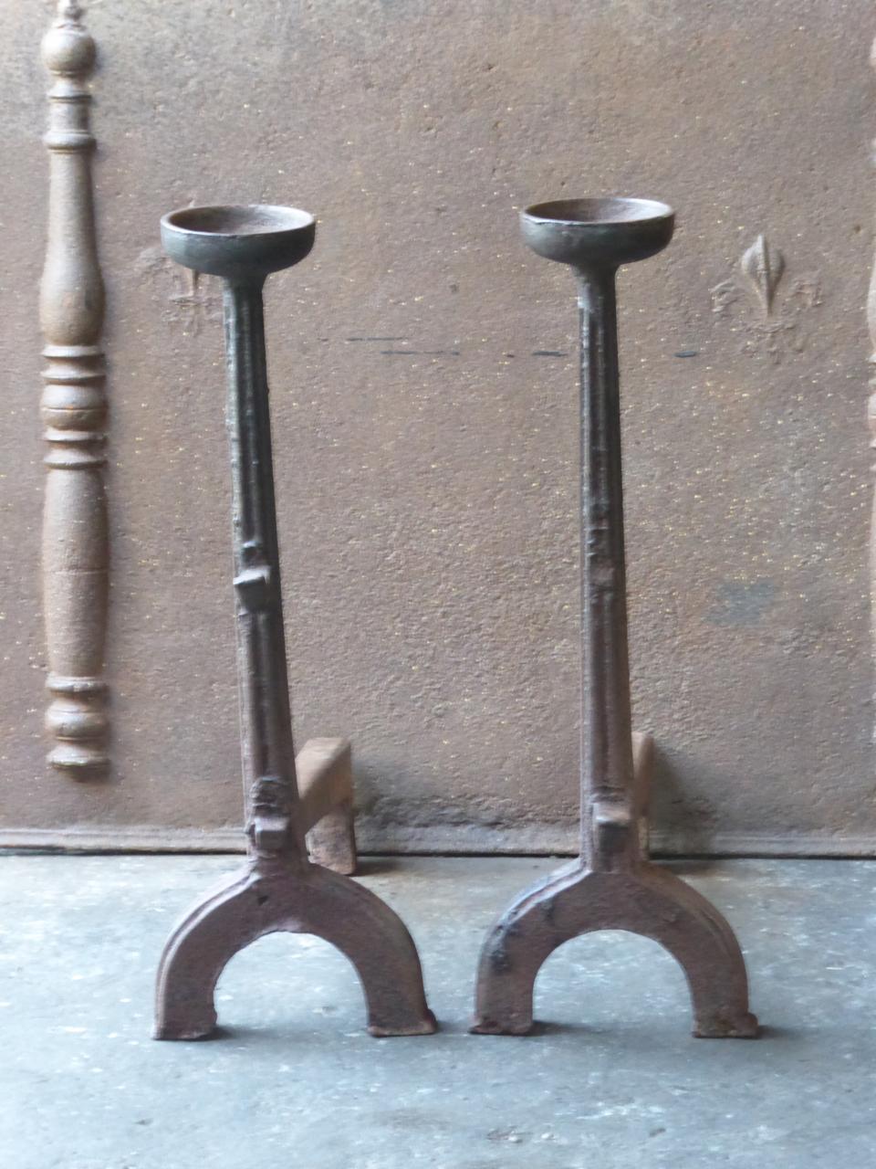 16th-17th century French Gothic andirons made of cast iron. The andirons have spit hooks to grill food. In France this type of very old andirons is called 'landiers'.

We have a unique and specialized collection of antique and used fireplace