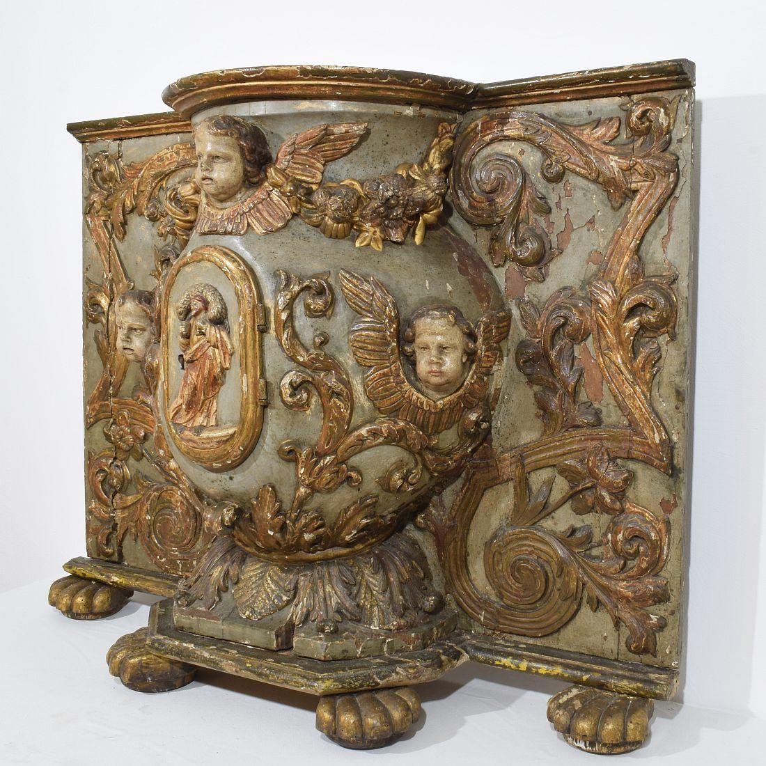Unique tabernacle with its original color and traces of gilding. 
On this amazing period piece are 3 angels visible and John the baptist holding the lamb god.
Italy, circa 1650- 1750.
Weathered, small losses and old repairs. Ofcourse this item had