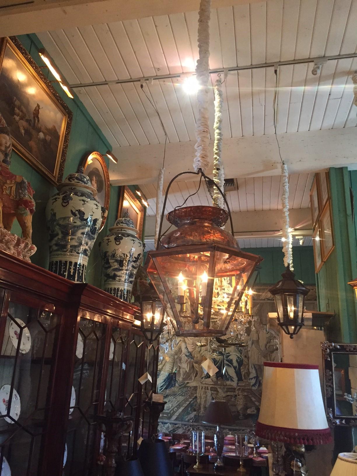 This charming large 17th-18th century Classic Louis XIV style antique look hanging copper lantern features a tiered top with a Lid that opens and close. La Maison Iron Work. The bracket that holds the Lantern in place if you have a windy exterior