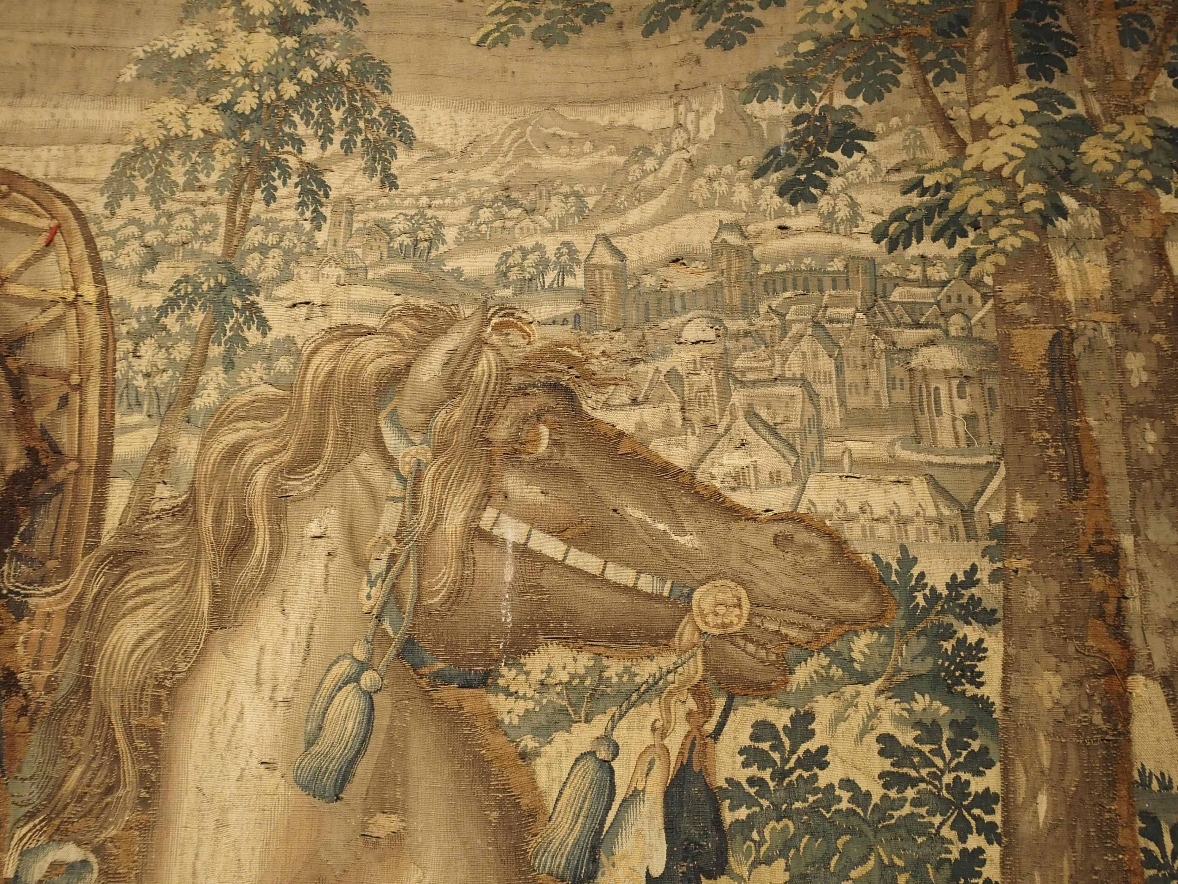 The details on this tapestry are absolutely superb. It was woven in Flanders in the 1600s. The village in the background for instance, is so finely woven you can see the architectural ornamentation of each building. Some of the foliate details