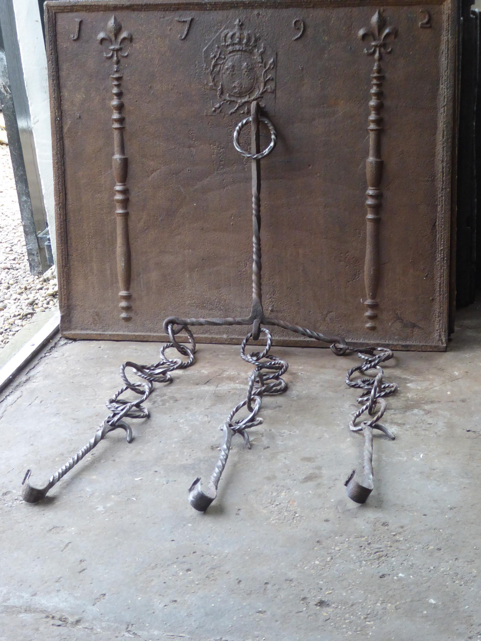 17th century French Louis XIV period fireplace trammel made of wrought iron. 

The trammel was used for cooking to regulate the distance between the pot and the fire. The trammel is still functional.
 