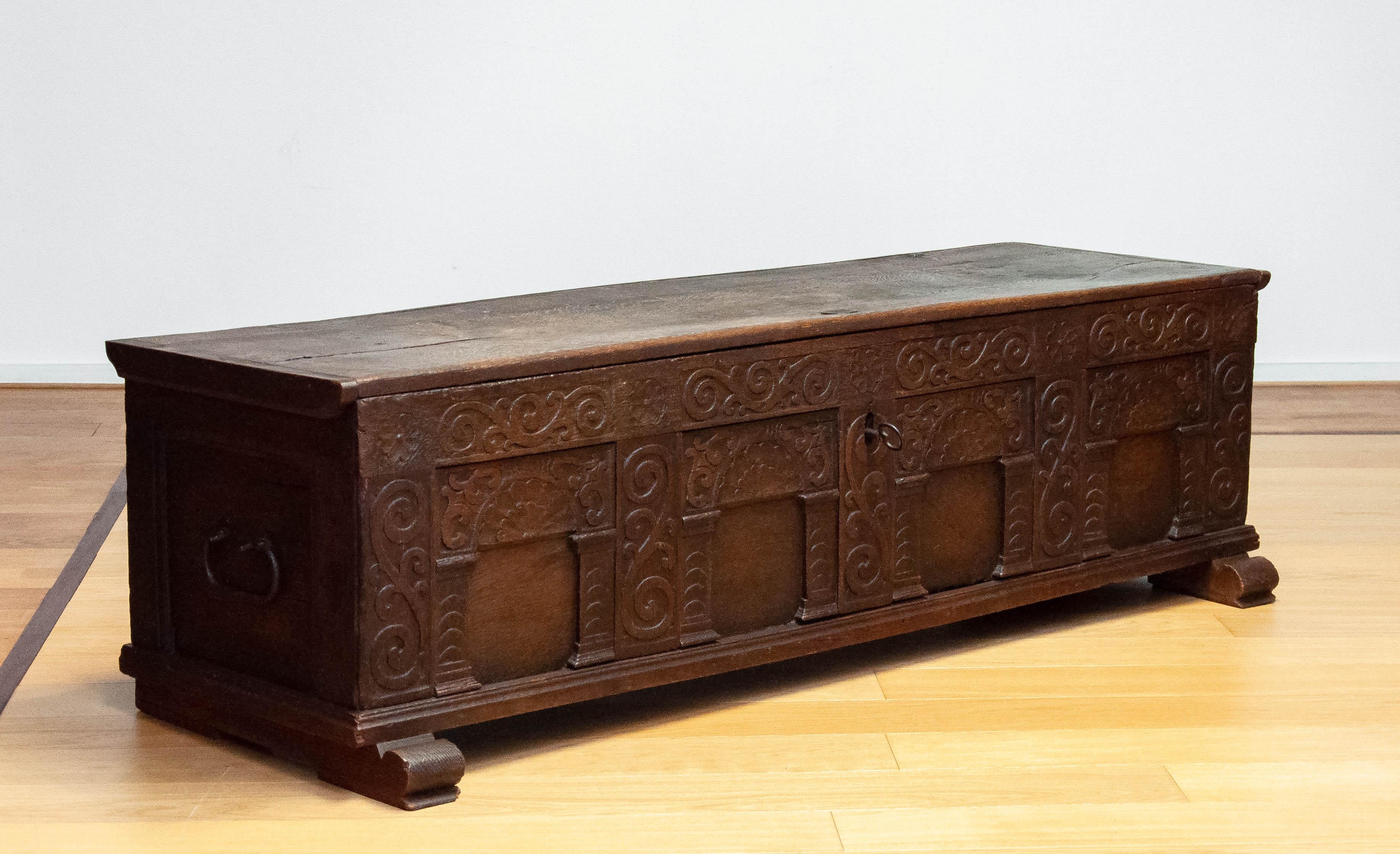 Absolute beautiful 17th century continental carved oak coffer, circa 1692.  Fine quality continental carved oak coffer from Germany, Free of any inscription. Beautifully carved arcaded front, complete with original lock and key and carrying handles