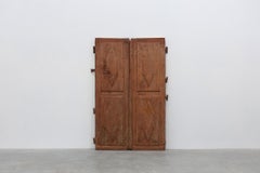 Large 17th century Monastery doors in terracotta lacquered oak, Portugal