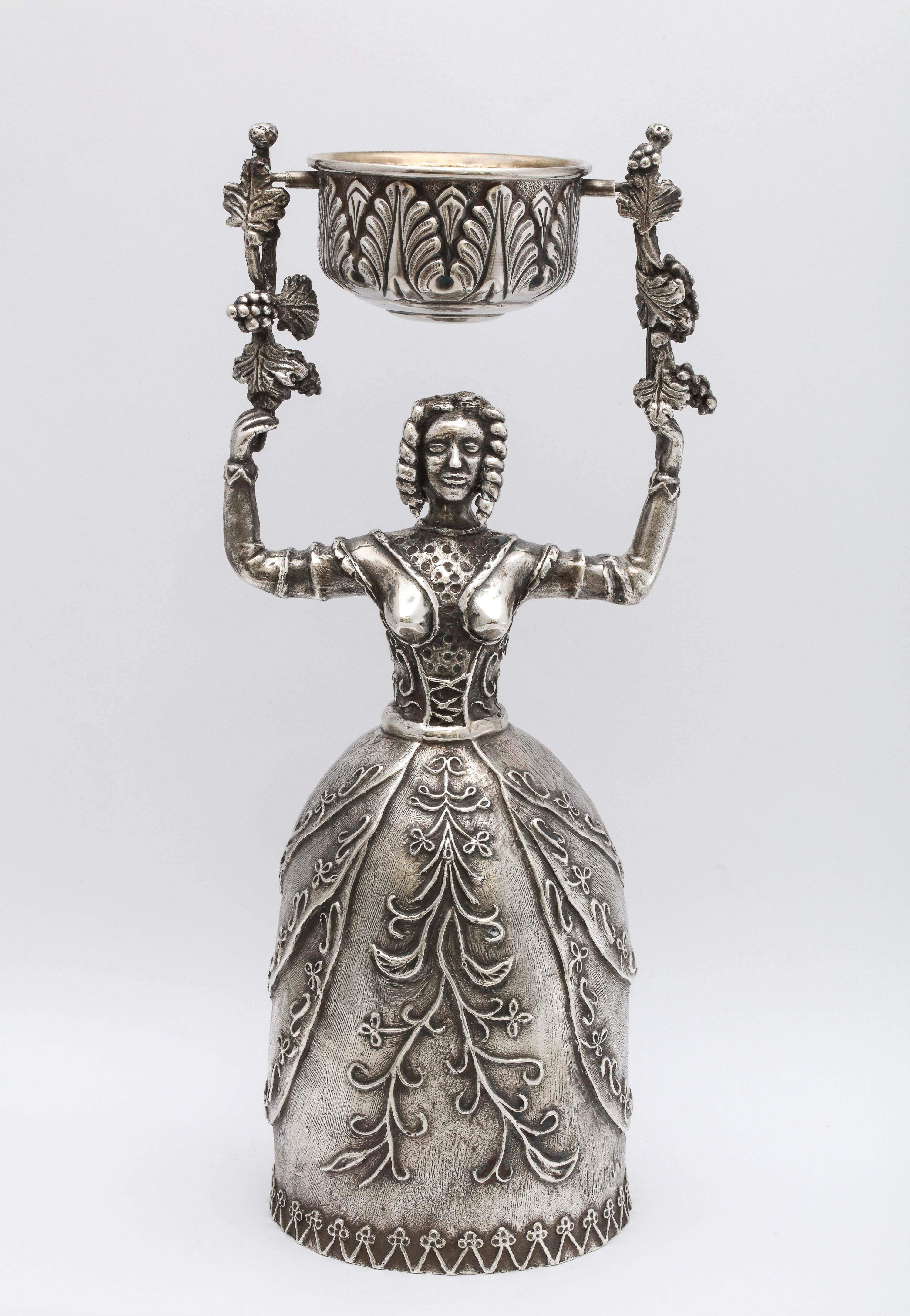 Large, 17th Century-Style sterling silver wager/marriage cup, Spain, circa 1950s, Damian Garrido - maker. Measures 9 3/4 inches high x almost 3 1/2 inches diameter across bottom of woman's skirt. Upper cup, which swivels on handles held up by the