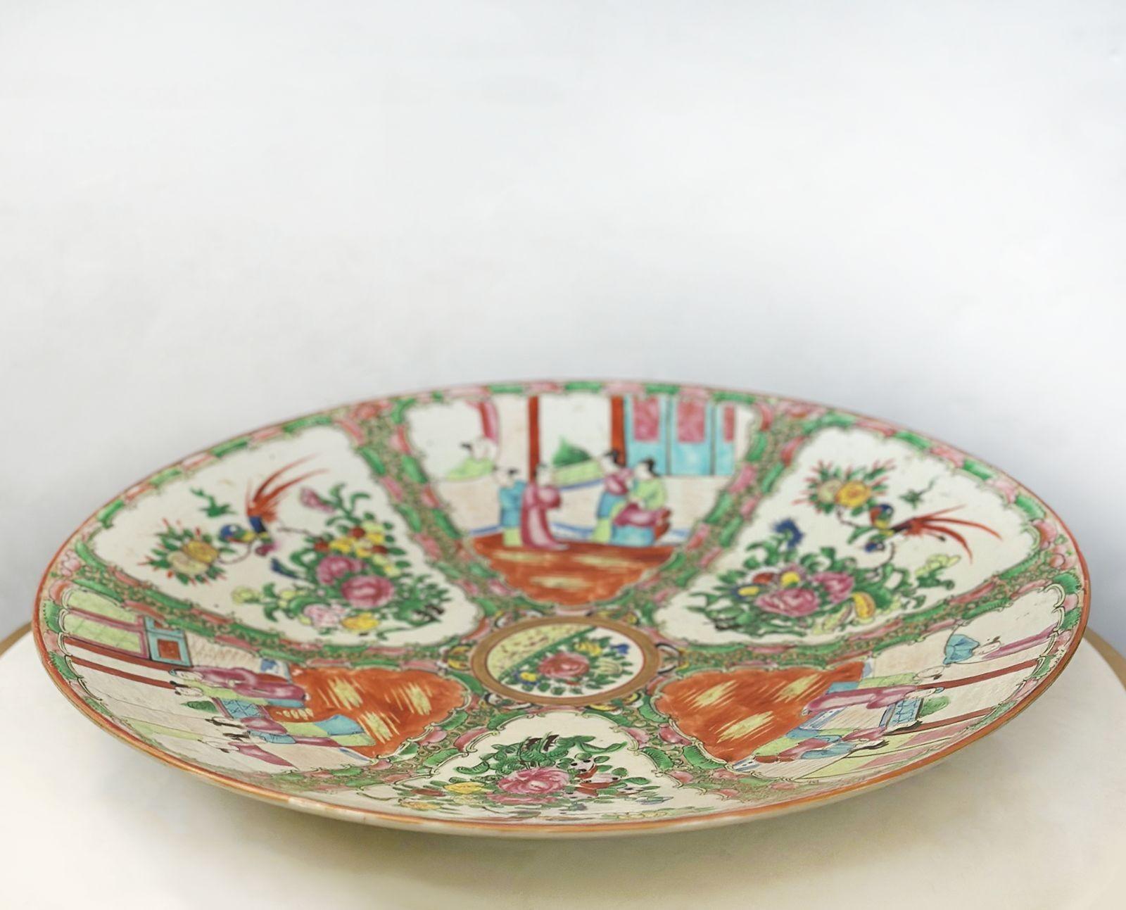 Large hand-painted Chinese Rose Canton charger plate having an arrangement of birds, flowers, butterflies and traditional scenes. Made in the 18/19th century.
Dimensions:
2.5