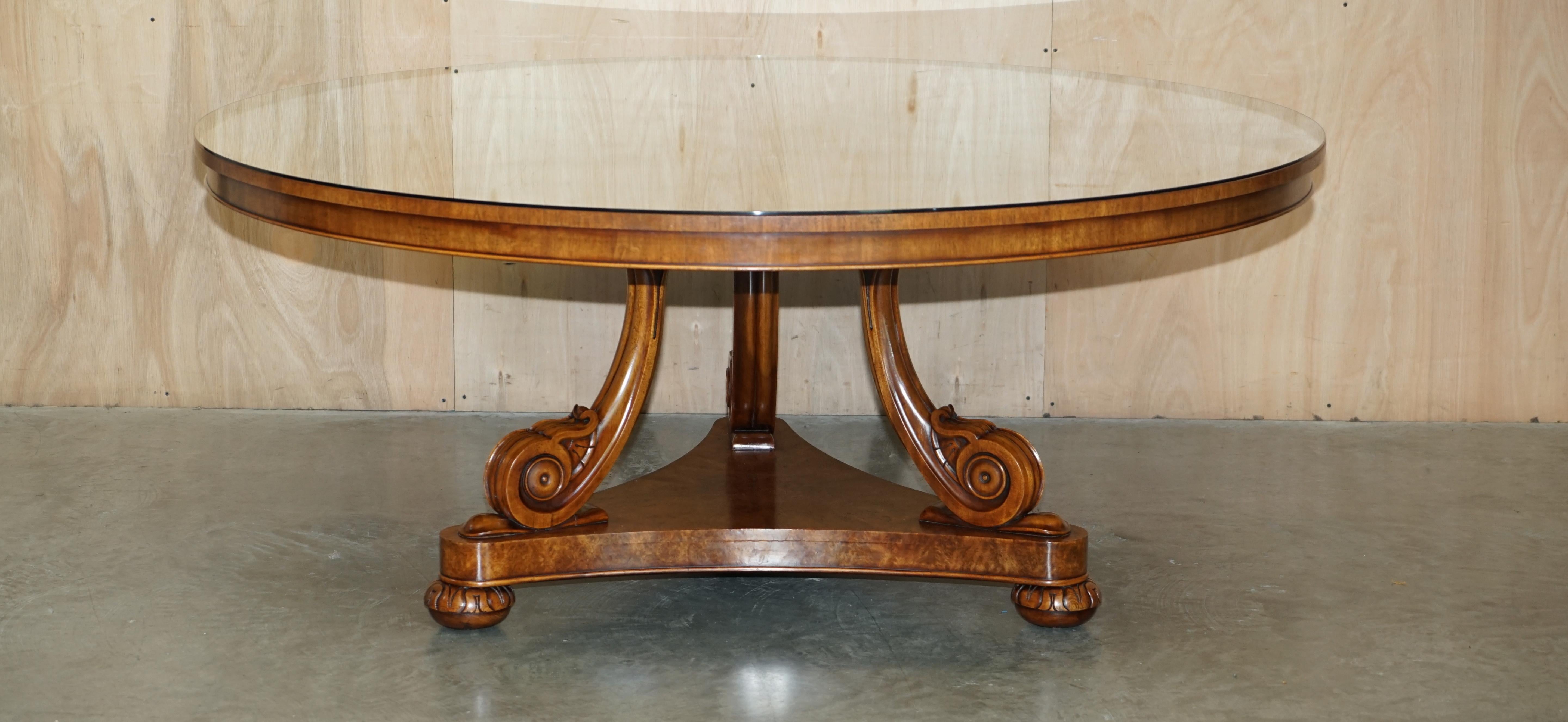 We are delighted to offer for sale this absolutely exquisite, Regency style, large round dining or huge centre table made with wonderful rich cuts of Burr Walnut, Mahogany & Satinwood

A truly sublime table, this is firstly very large, it seats