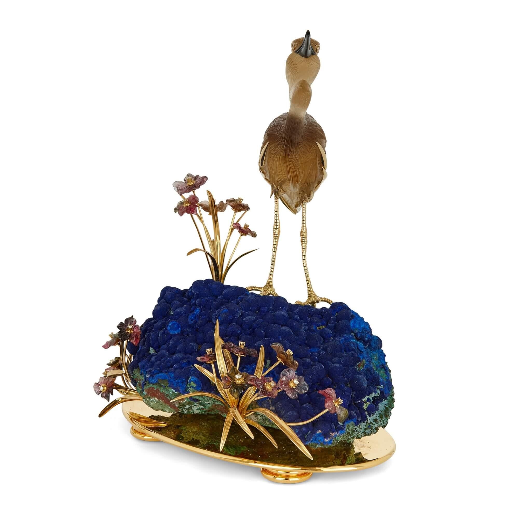 Large 18K gold, silver gilt, diamond and hardstone bird model by Asprey
English, c. 1980
Height 22cm, width 17cm, depth 15cm

Made in around 1980, by the renowned British firm of Asprey, the model depicts a heron standing on a rock among greenery