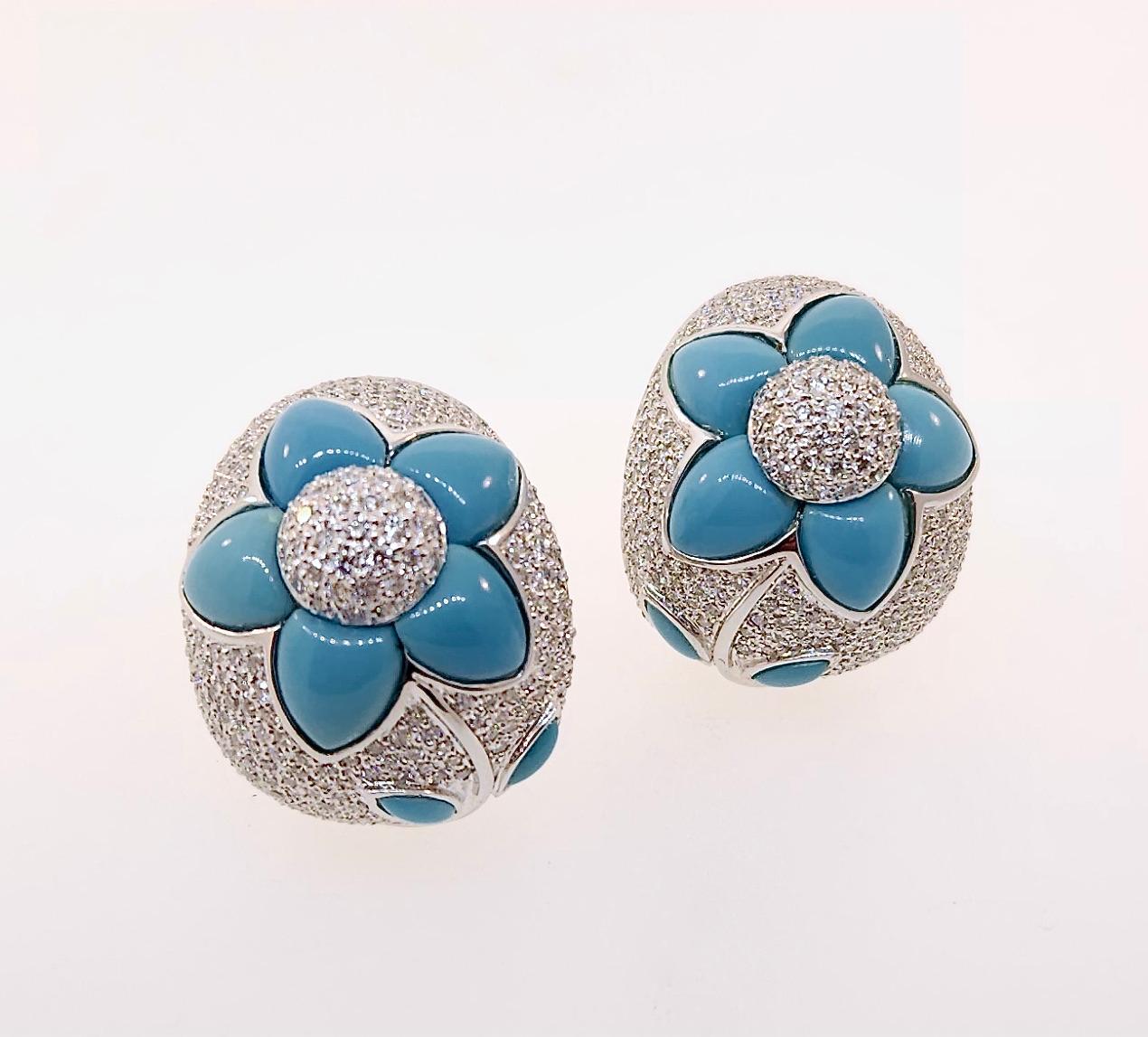 Thank you for viewing these large 18k white gold diamond & turquoise earrings.  There are approximately 775 diamonds weighting approximately 6.00 carats.  The diamonds are an average color of H/I with an average clarity of SI2.  The earrings weight