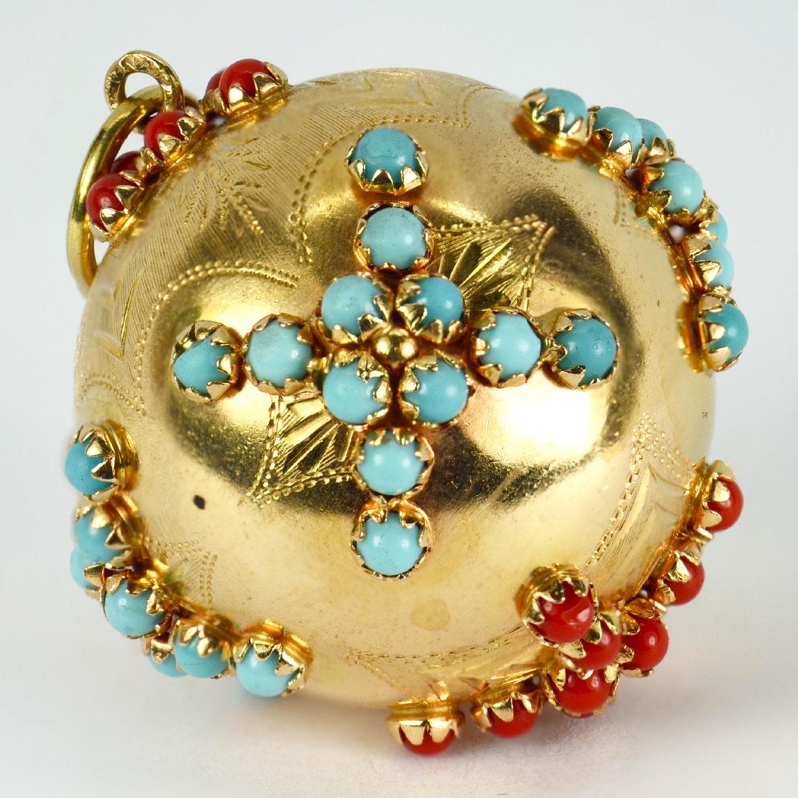 A large 18 karat (18K) yellow gold charm pendant designed as a sphere set with coral and turquoise cabochons. Stamped 750 to the bail for 18 karat gold. One coral bead missing.

Dimensions: 4 x 3.5 x 3.5 cm (not including jump ring)
Weight: 20.81