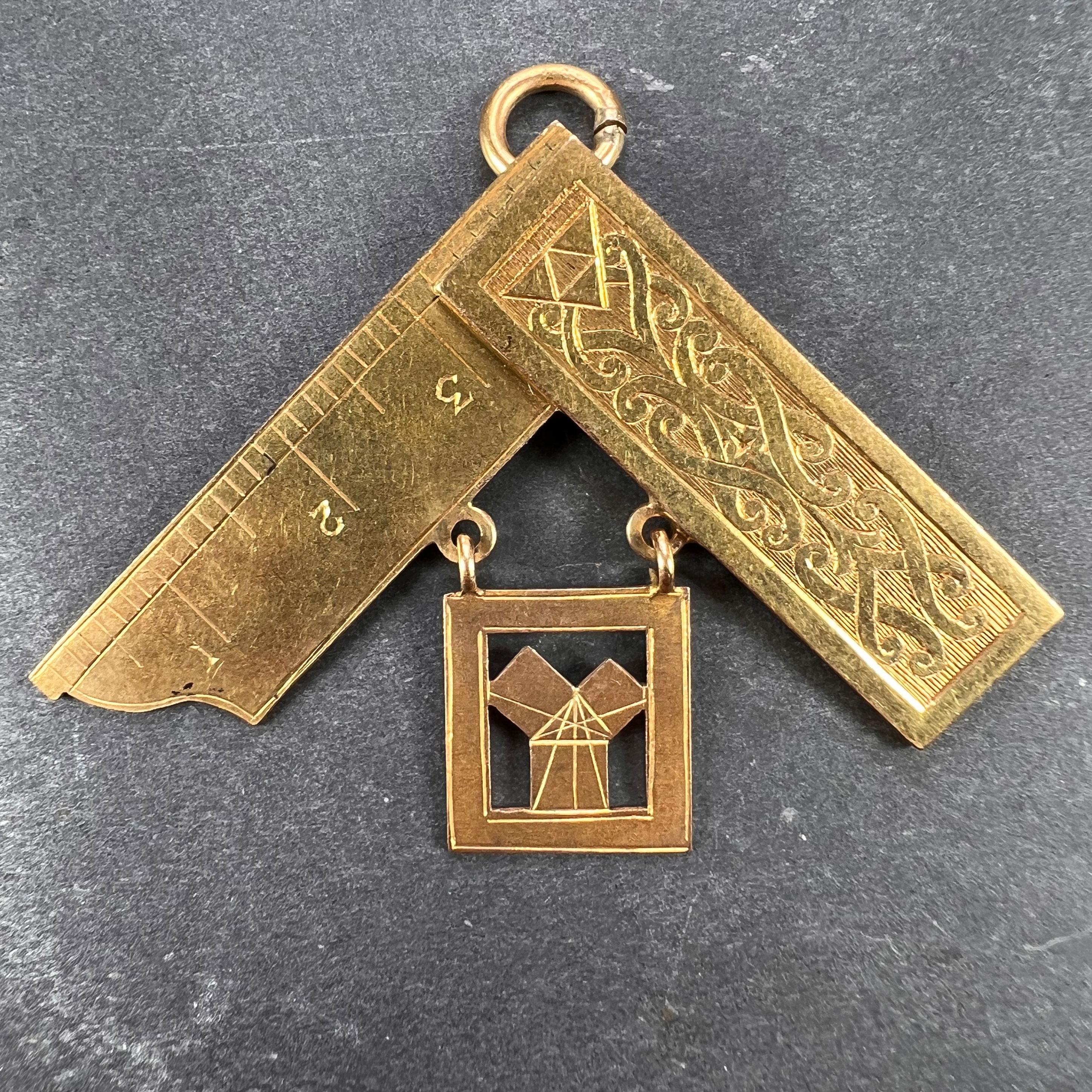 A large yellow gold charm pendant designed as a Masonic set square inscribed ‘Presented by the Officers and Brethren of the lodge to Wor. Bro. Ernest Sykes as a mark of their esteem and appreciation on the termination of his year as W.M. Dec 6th
