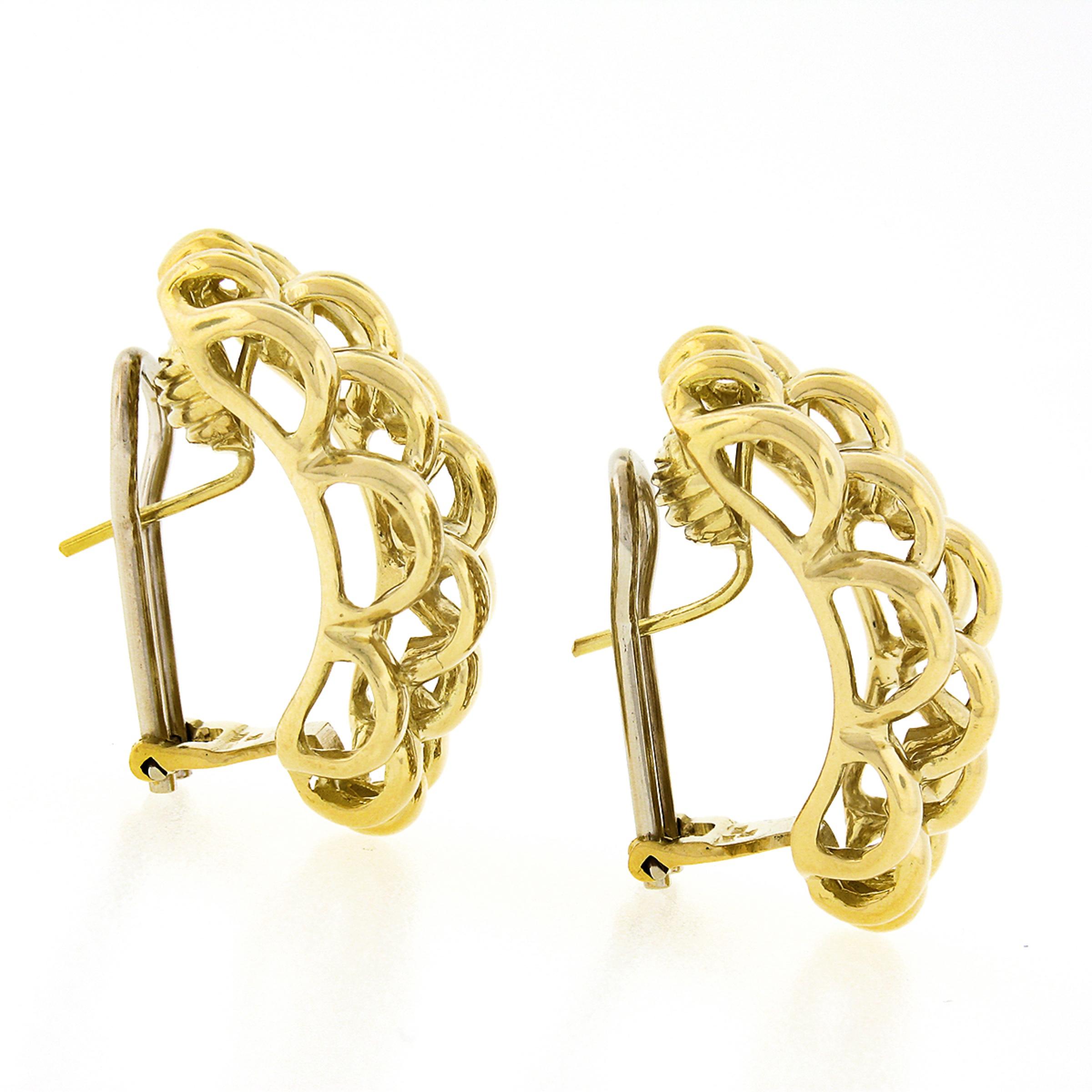 These large cuff earrings are very well crafted in solid 18k yellow gold and feature a wide panther style design with a nice high polished finish throughout. These earrings look absolutely elegant on the ear and will perfectly complete your day or