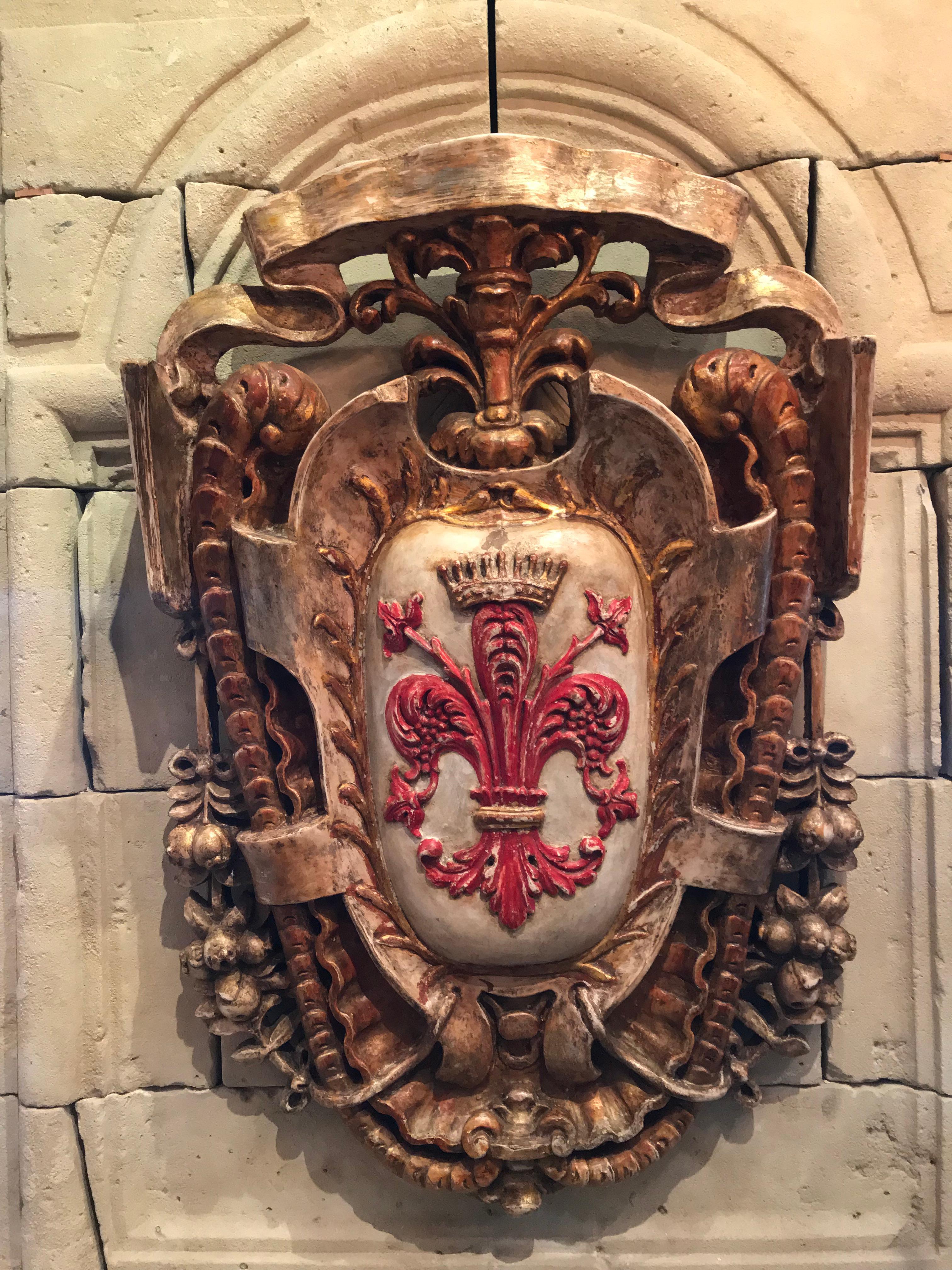 Beautiful 18th-19th century hand carved with scrolls fleur-de-lis (or fleur de lys) and topped with a crown as an emblem of indisputable sovereignty.
Great to use as a sculpture, architectural element above an exterior entrance a bedroom, entryway