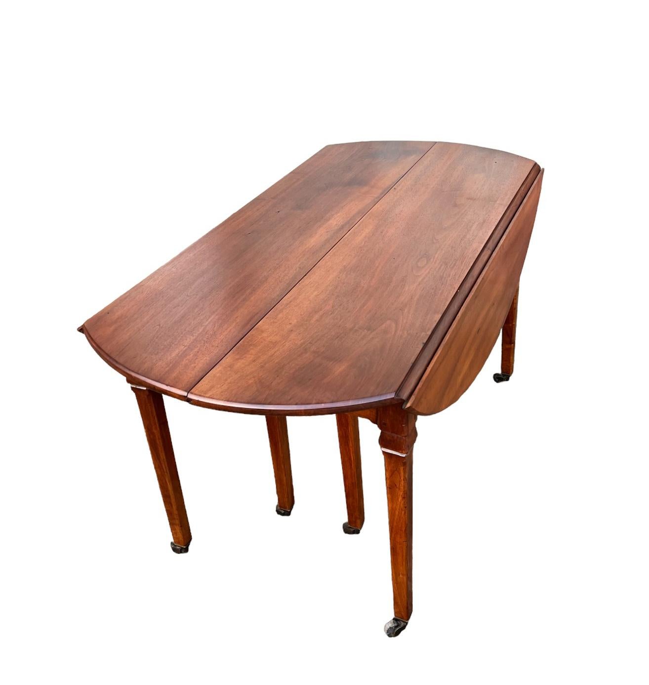 Large banquet or conference table, in a massive walnut, from the end of the eighteenth century.

It opens by 7 extensions also in solid walnut to reach the length of 566 cm (222.8 inches) and rests a base in a chamfered sheath, carved in the upper
