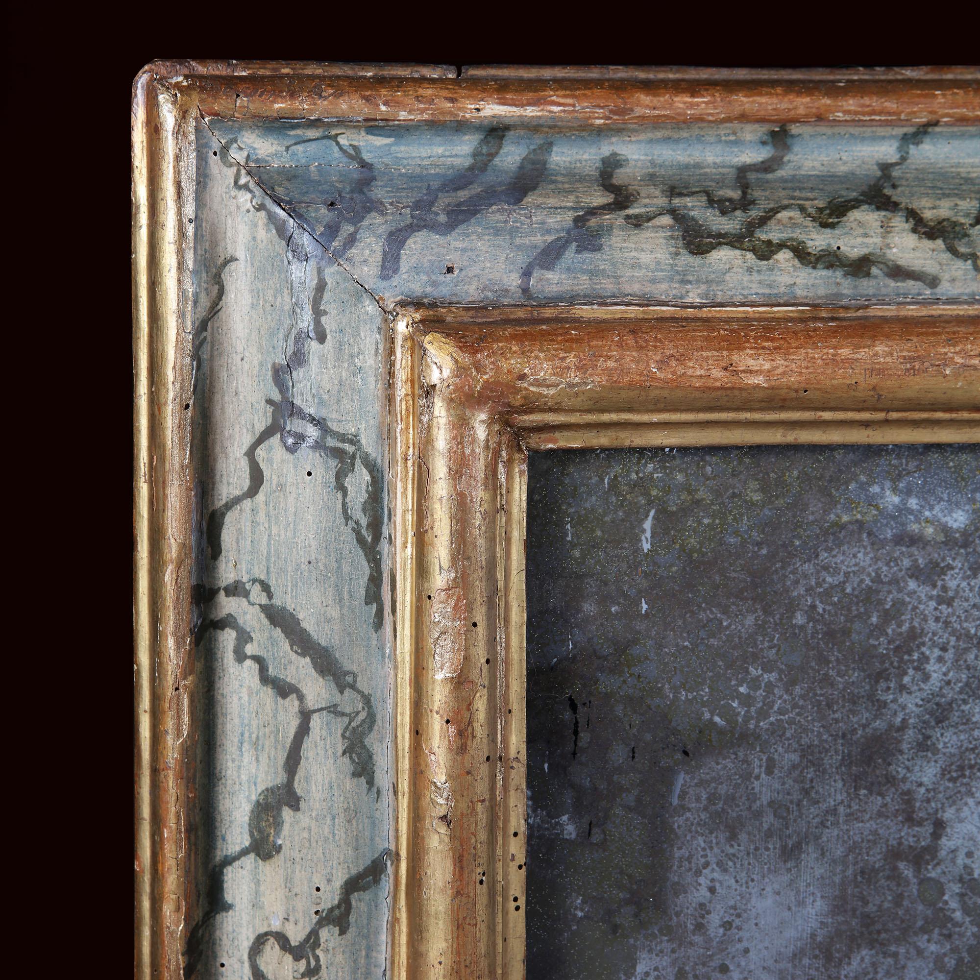 A large late 18th century blue and gold painted and giltwood Italian mirror frame, with painted faux marble effect to the border, between two giltwood bands. With mercury mirror plate.