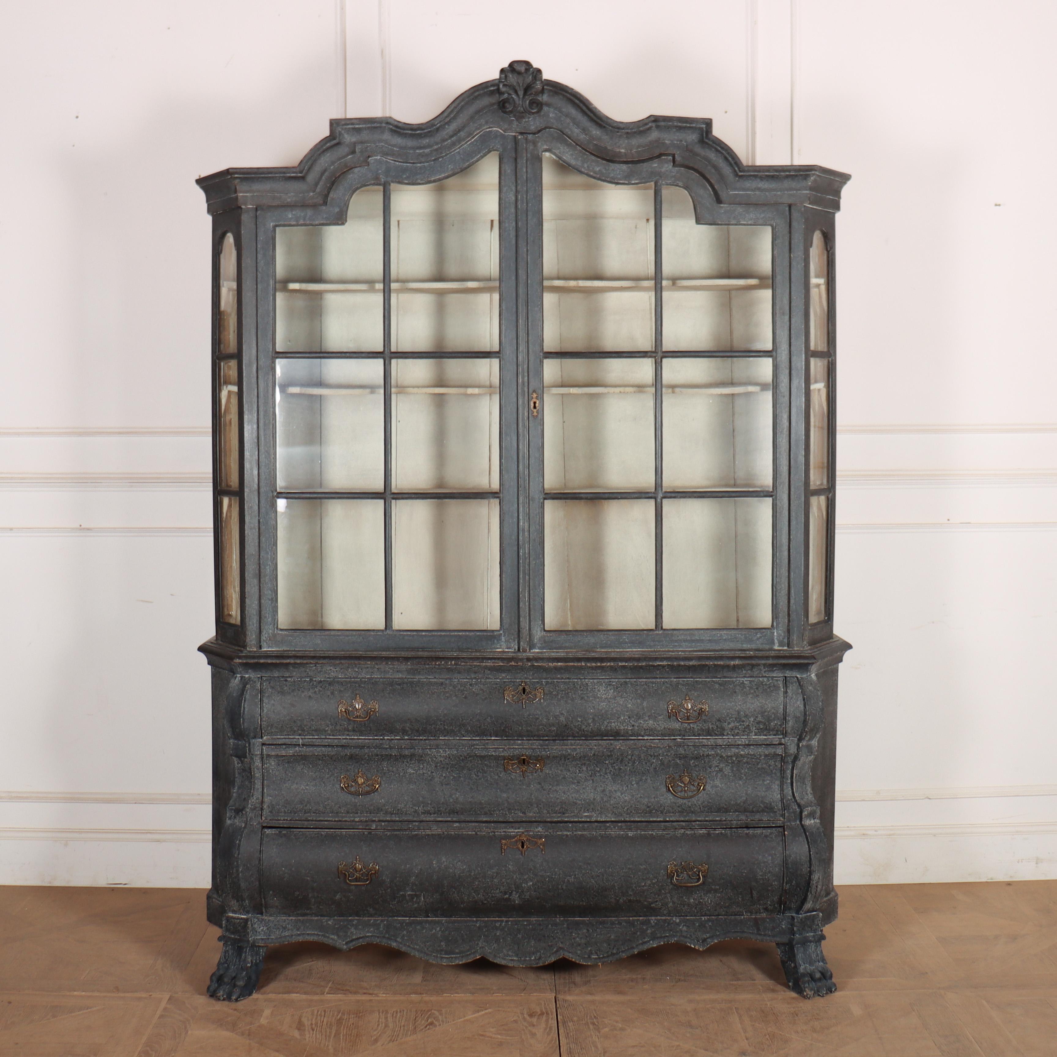 Large 18th Century Dutch bombe glazed display cabinet with mottled black paint finsih and old white interior. 1780


Please note, the top section can dismantle for delivery and international shipping.
