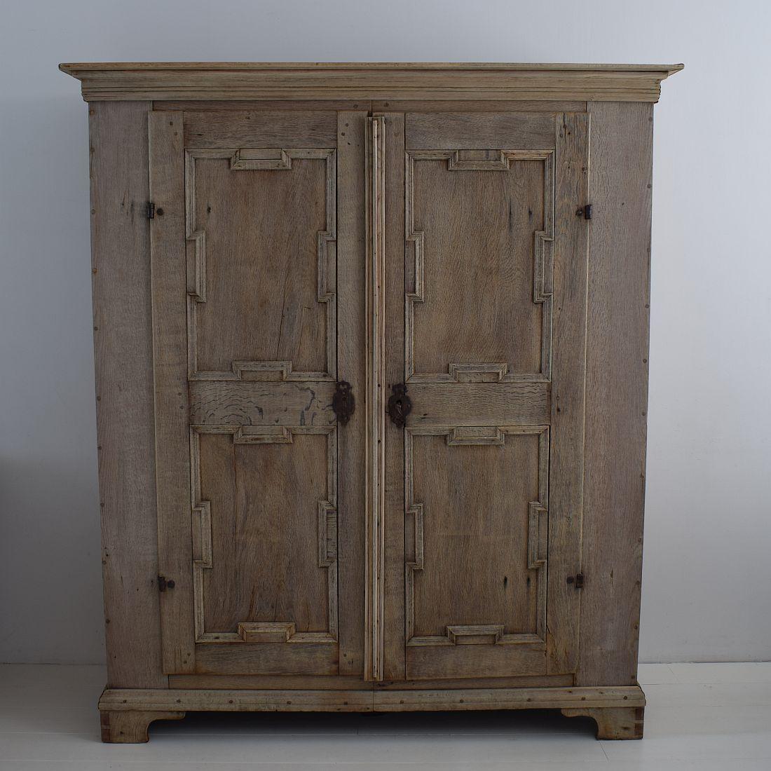 Rare and large Dutch oak armoire with hand forged iron hinges. Great weathered look.
Holland, circa 1750-1800. Made out of two pieces and a separate top for easier transport.
Weathered, small losses and old repairs.
More pictures are available on