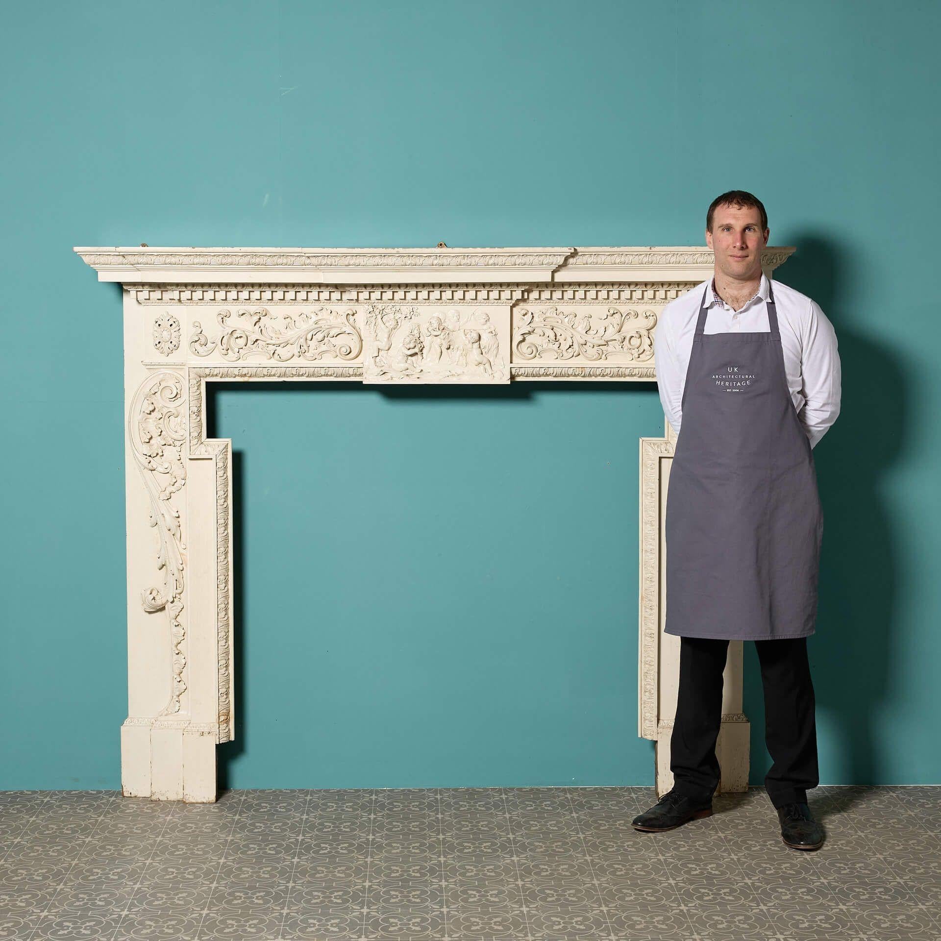 A large and richly decorated 18th century English breakfront carved pine fire mantel, originally from Hambledon House, North Yorkshire (pictured).

We believe the carving to be 18th century, with the structure altered and added to around 1900.

This