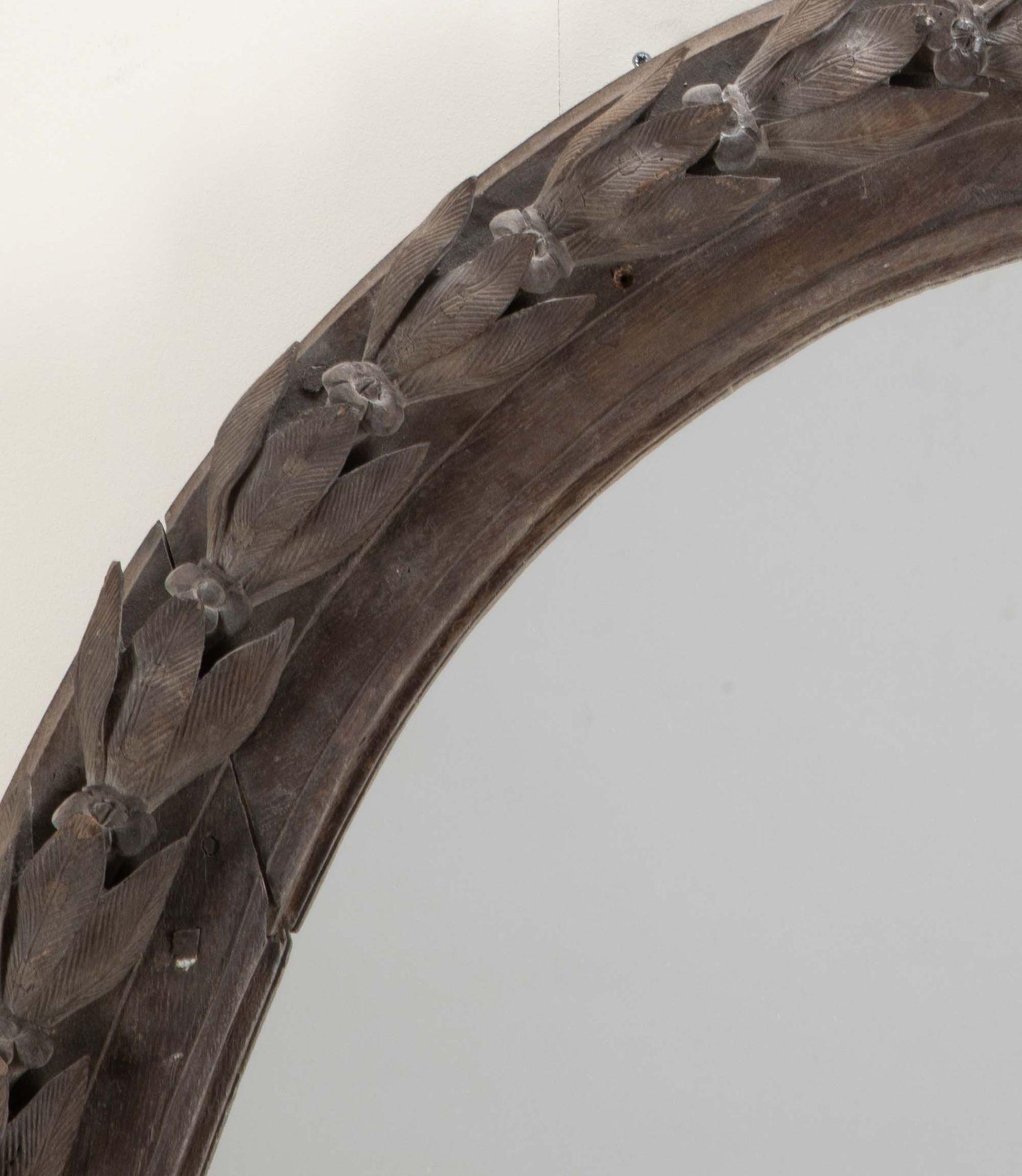A fine and large 18th Century French mirror.
In a deeply carved oval frame with new glass.
Circa 1750.