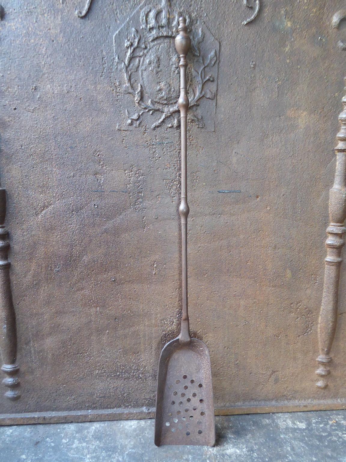 Large 18th century French fireplace shovel made of wrought iron.