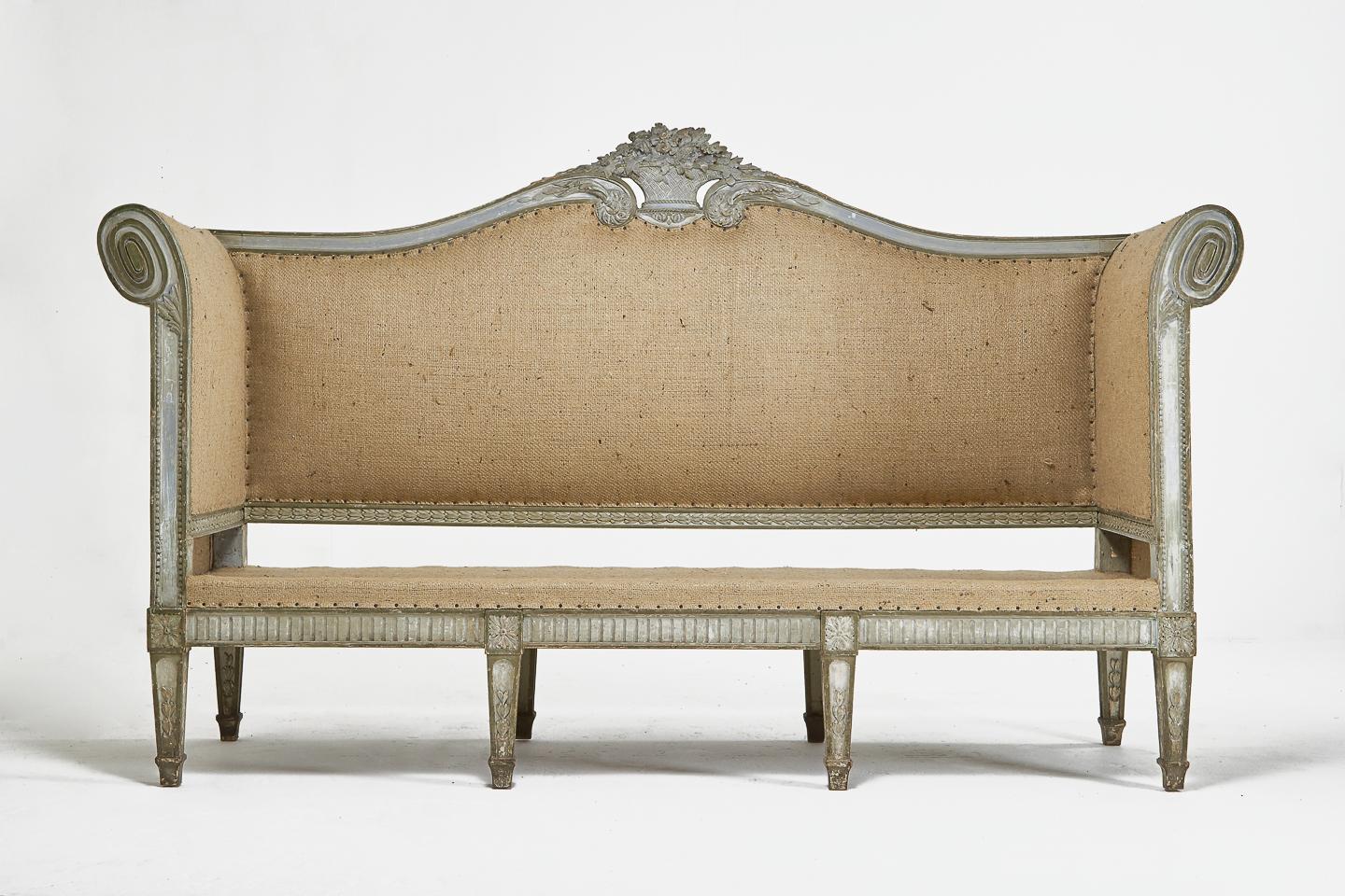 A beautifully carved large 18th century French sofa with original paint. Feathered seat pad upholstered in a vintage French cotton linen mix fabric. Carcass upholstered in hessian and is ready to recover or can be used as it is.