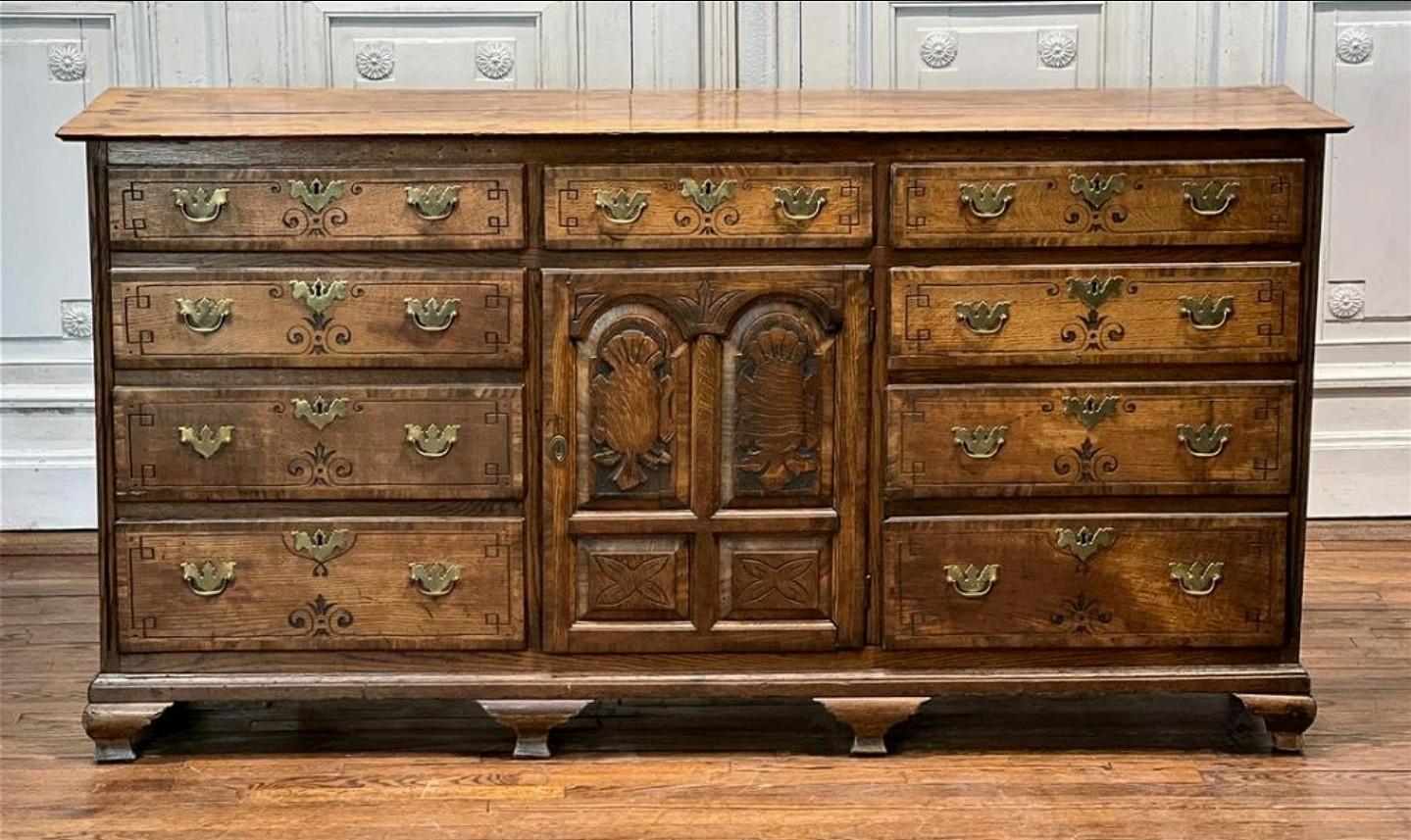 A period George III (1760-1820) English oak kitchen dresser base with attractive mellow patina and interesting provenance!

Originally the purpose of a dresser was to 