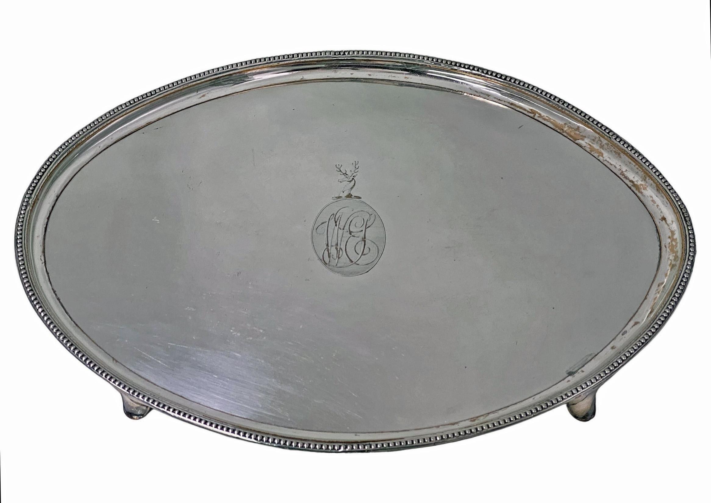 Large 18th century Georgian old sheffield salver England circa .1780. Rare oval shape on four turned supports, bead border and engraved crest of stag in the centre with monogram beneath. Original patina, bleeding in on high points. The base with