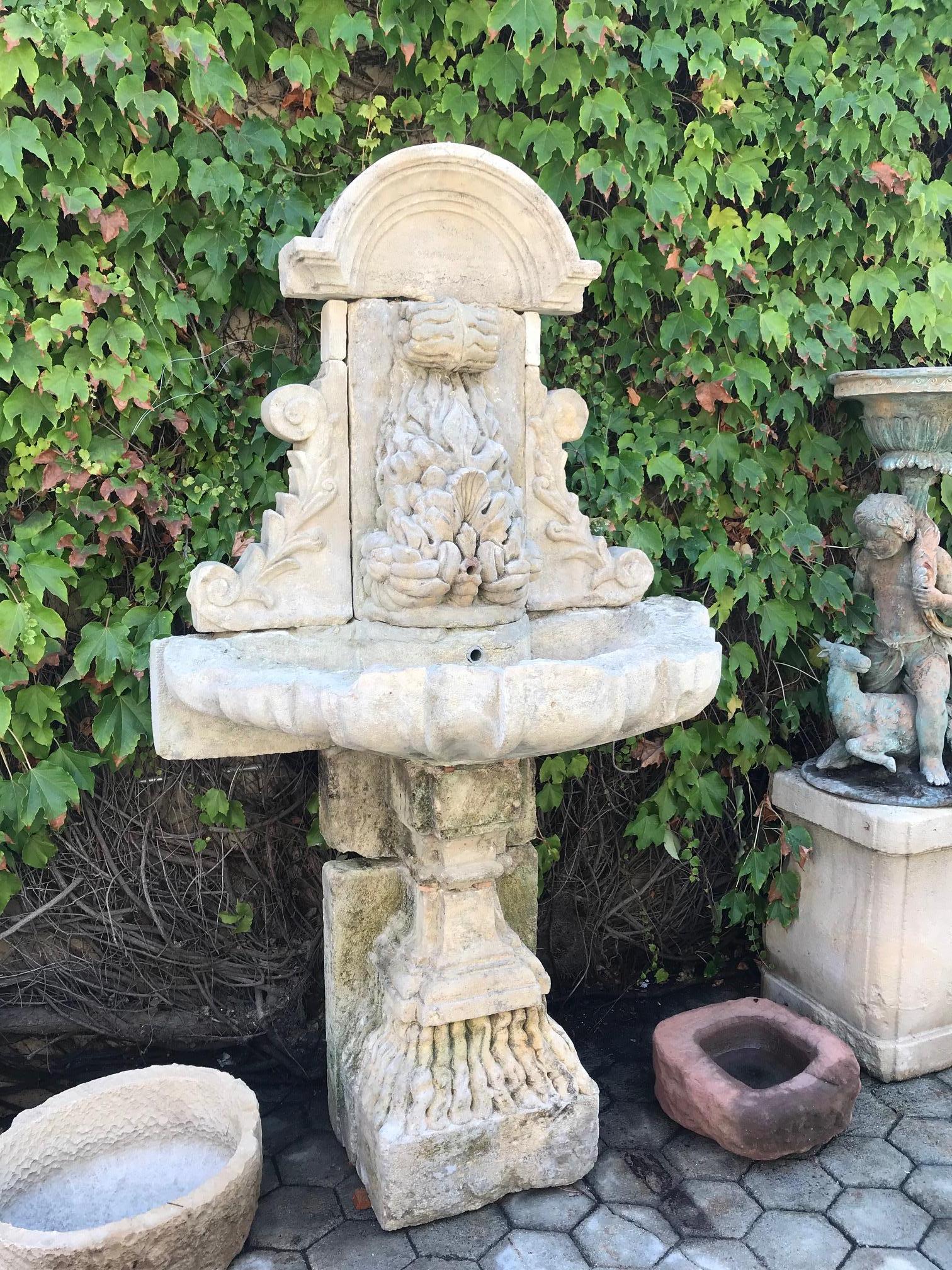 Large 18th Century Hand Carved Stone Wall Fountain and basin on pedestal base LA In Good Condition In West Hollywood, CA