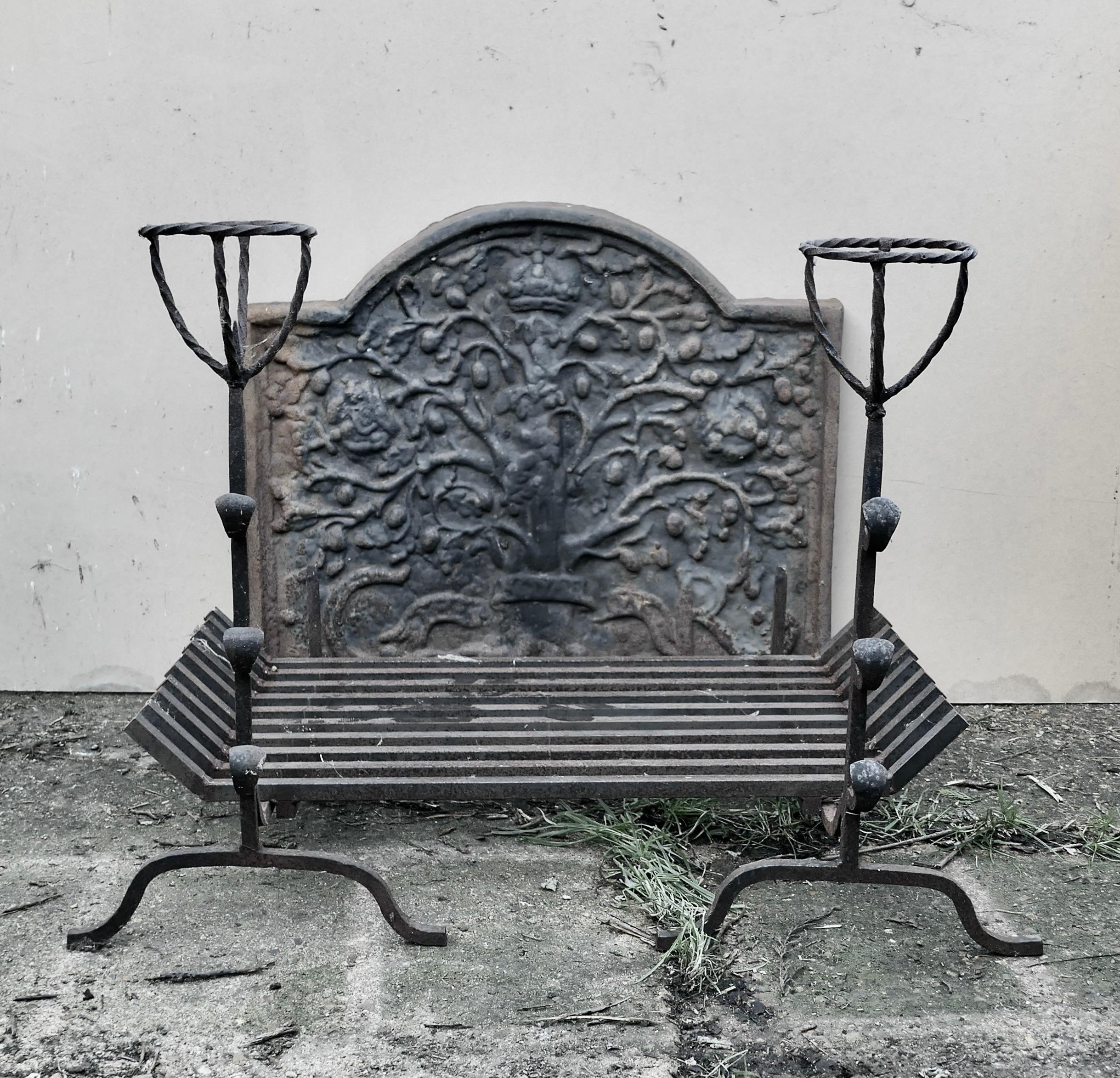  Large 18th Century Heavy Iron Fire Back, Andirons and Grate 

This is an Early Very Heavy Large Fire Back Matched with an 18th Century Pair of Iron Andirons and a replacement Large Grate 

The fire back is definitely not a reproduction it is an