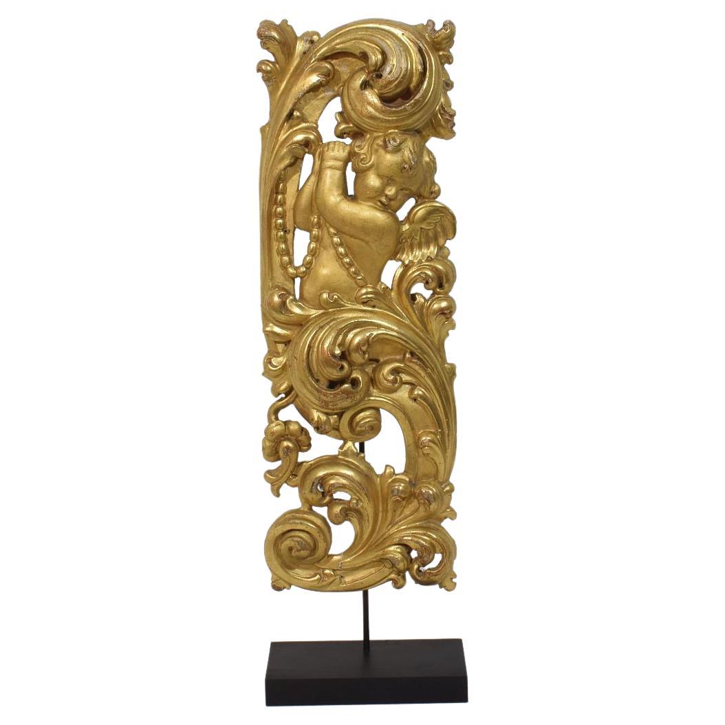 Large 18th Century Italian Hand Carved Giltwood Baroque Curl Ornament With Angel For Sale