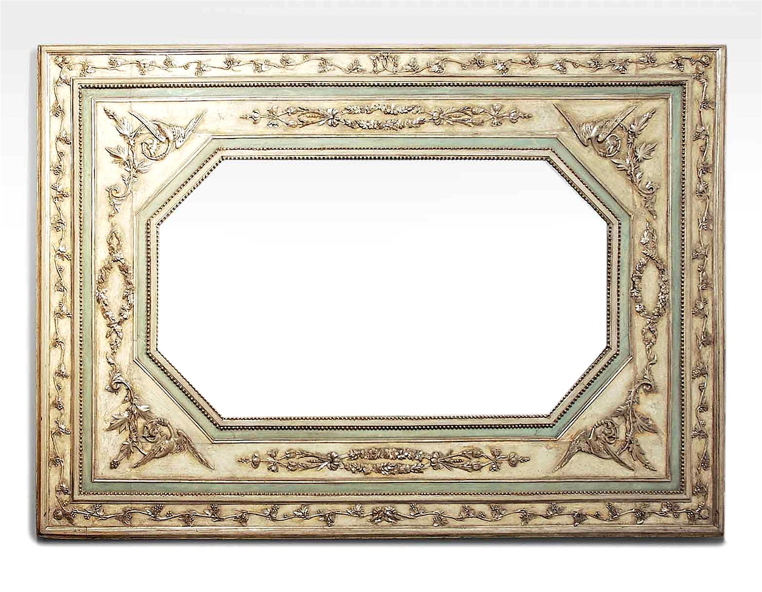Italian Neoclassic (18th Century) white painted and celadon trimmed wall mirror with carved silver gilt floral decorations and border with an octagonal inset mirror.
