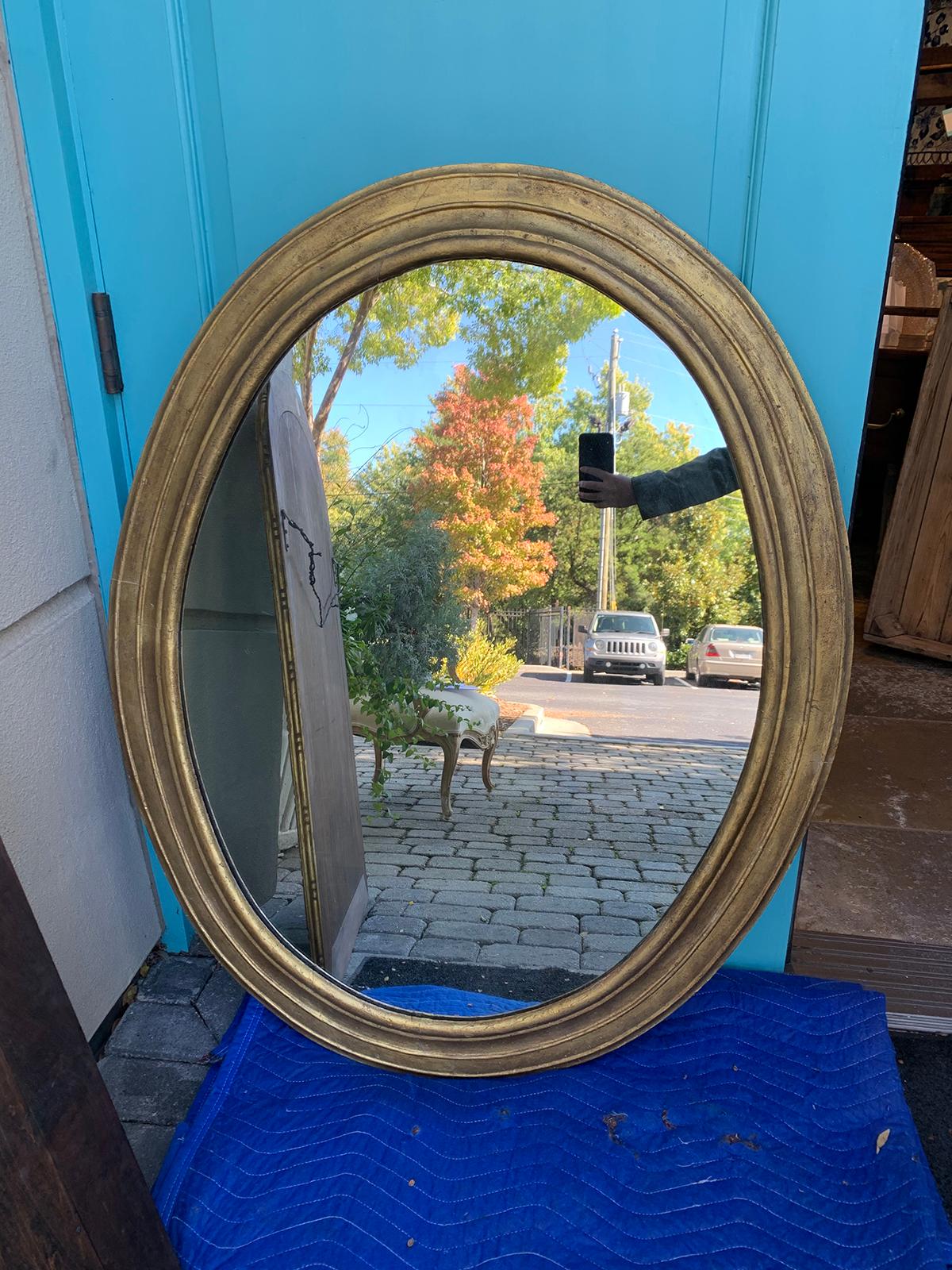 Large 18th century Italian neoclassical oval mirror.