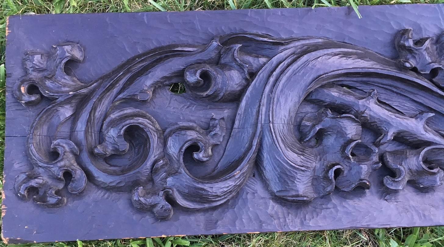 Large 18th Century Colonial Pennsylvania carved pine over-mantle panel, a hand-carved pine single board frieze  with deep bas relief acanthus leaf scrolls against a scoop carved background. Panel is in its original dark matte finish, and retains a