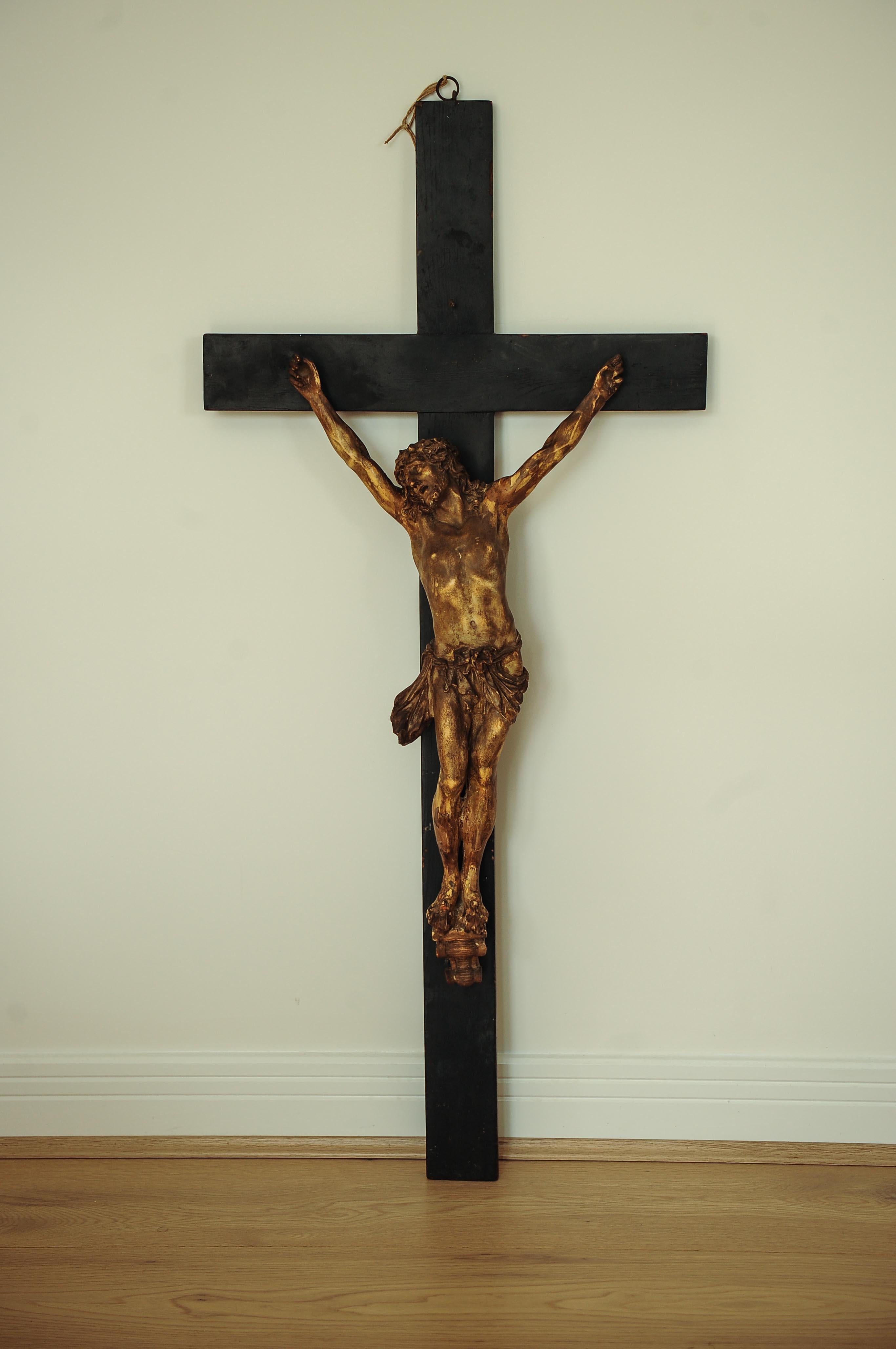 A superb 18th century example of Jesus Christ crucified on the cross. Figure has been sculpted from plaster and afixed to a simple wooden cross.