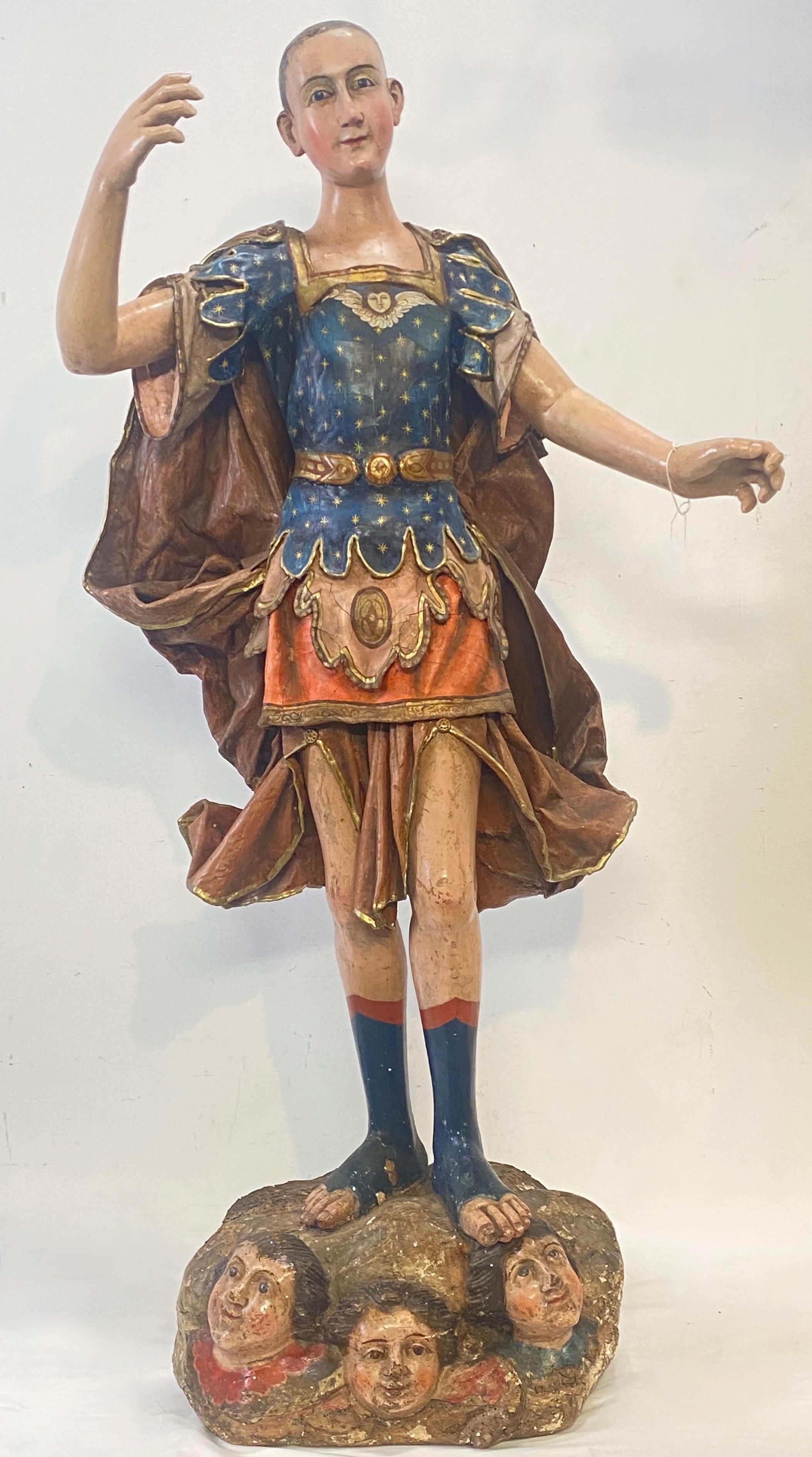 An impressive life size late 18th century Spanish Colonial Santo figure, most likely Mexican. Carved and painted wood, the cape and other clothing is gessoed and painted canvas with wonderful detail. Condition is remarkable, though the paint appears