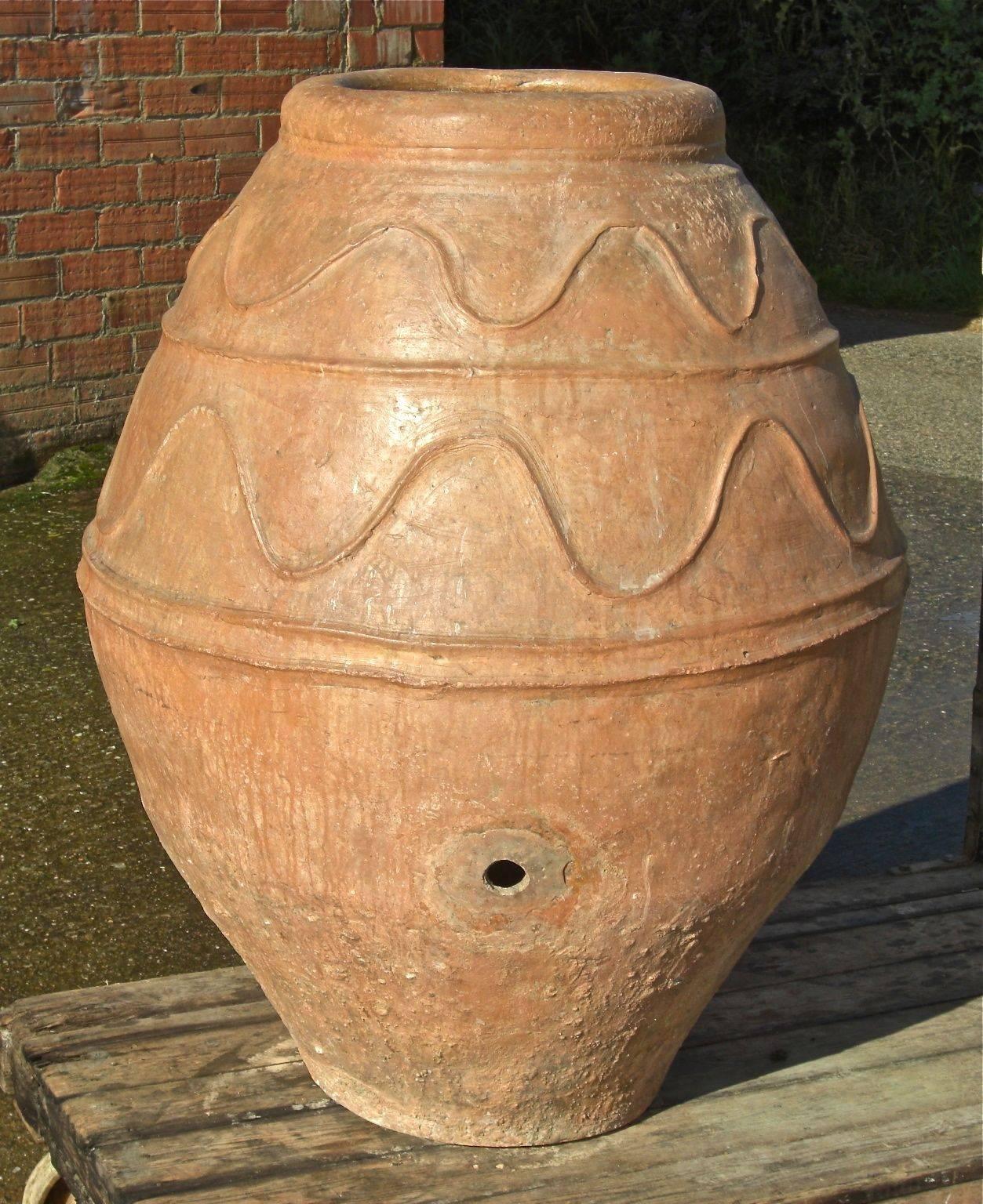 This impressive late 18th century terracotta water jar was found in the town of Tarazona in the province of Zaragoza (Aragon), Spain. 

In excellent condition and with great character, this jar once had a wooden or metal spigot and served as the