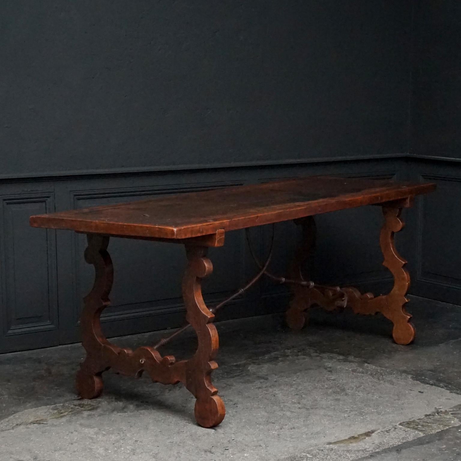 This long refectory table with original wrought iron curled stretchers would be perfect as kitchen or dinner table or as large hallway centre or side table.

The table is narrow but long and it would easily seat 4-6 comfortable spacious arm chairs