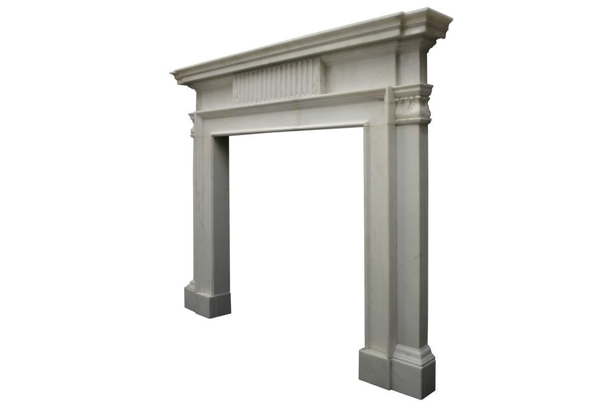 Large 18th century Georgian statuary marble chimneypiece. The deeply moulded and breakfront shelf sits above the frieze centred by a plaque finely carved with flutes and arrows, supported on a plain bollection underfrieze. The plain jambs terminate