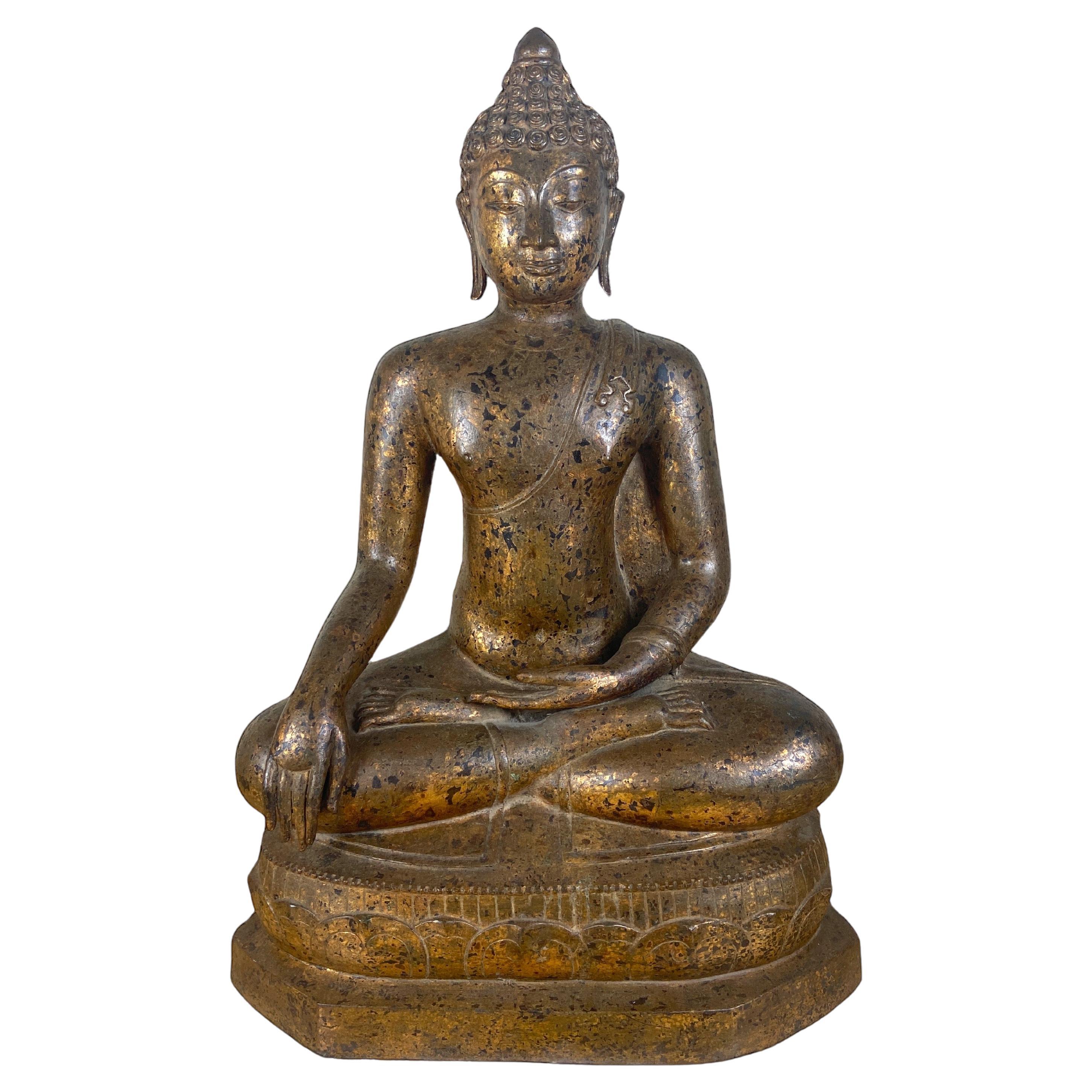 Large 18th century Thai gilt bronze seated figure of Buddha Shakyamuni