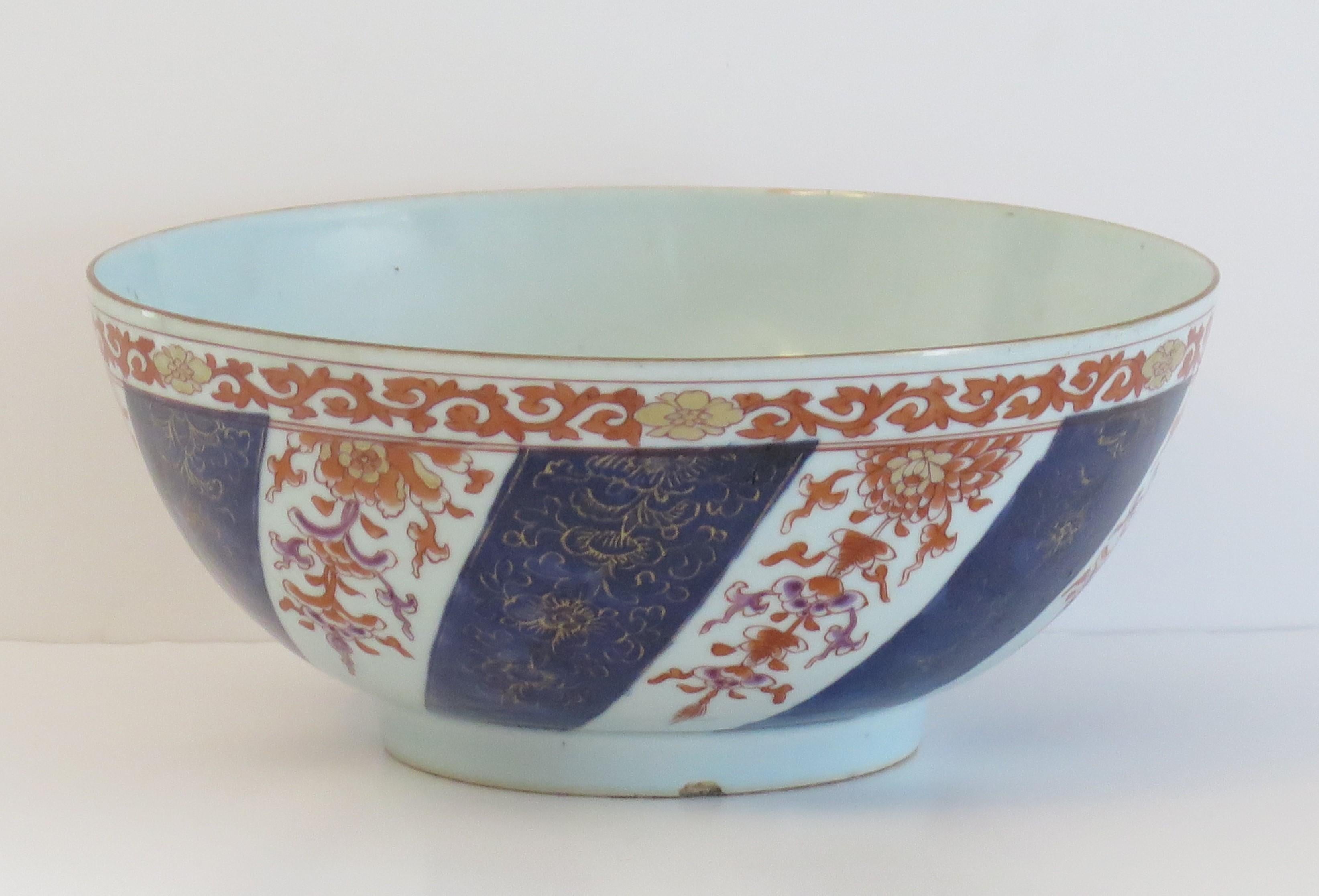 This is a Large 10.6 inch diameter Chinese Export porcelain footed Bowl with hand painted Imari decoration, which we date to the second half of the 18th Century, Qing period, circa 1770. 

This bowl is well potted on a fairly high foot. The glaze is