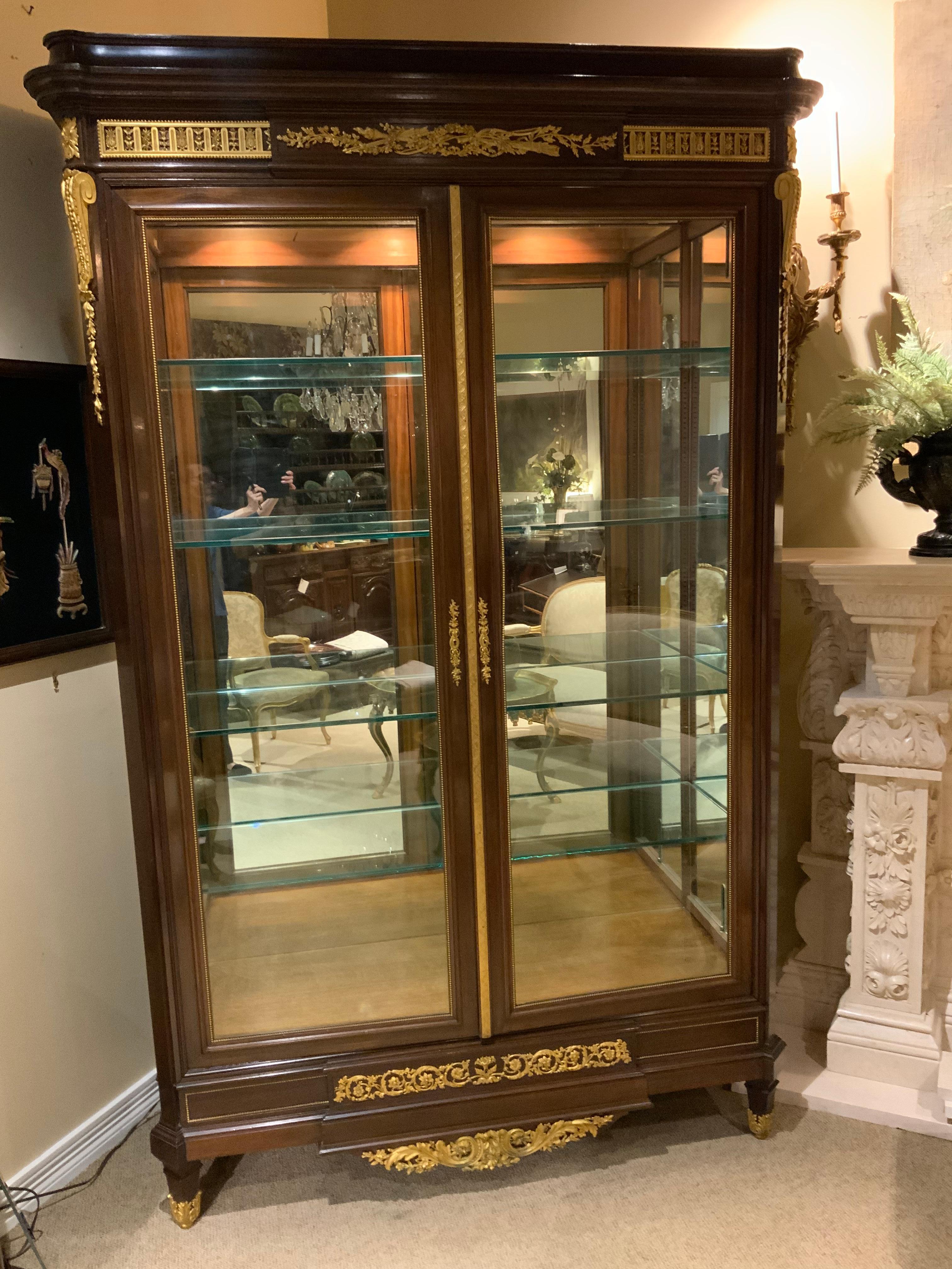 Glass Large 19th C. Mahogany Display Cabinet Lighted, Mirror Back, Louis XVI-Style For Sale