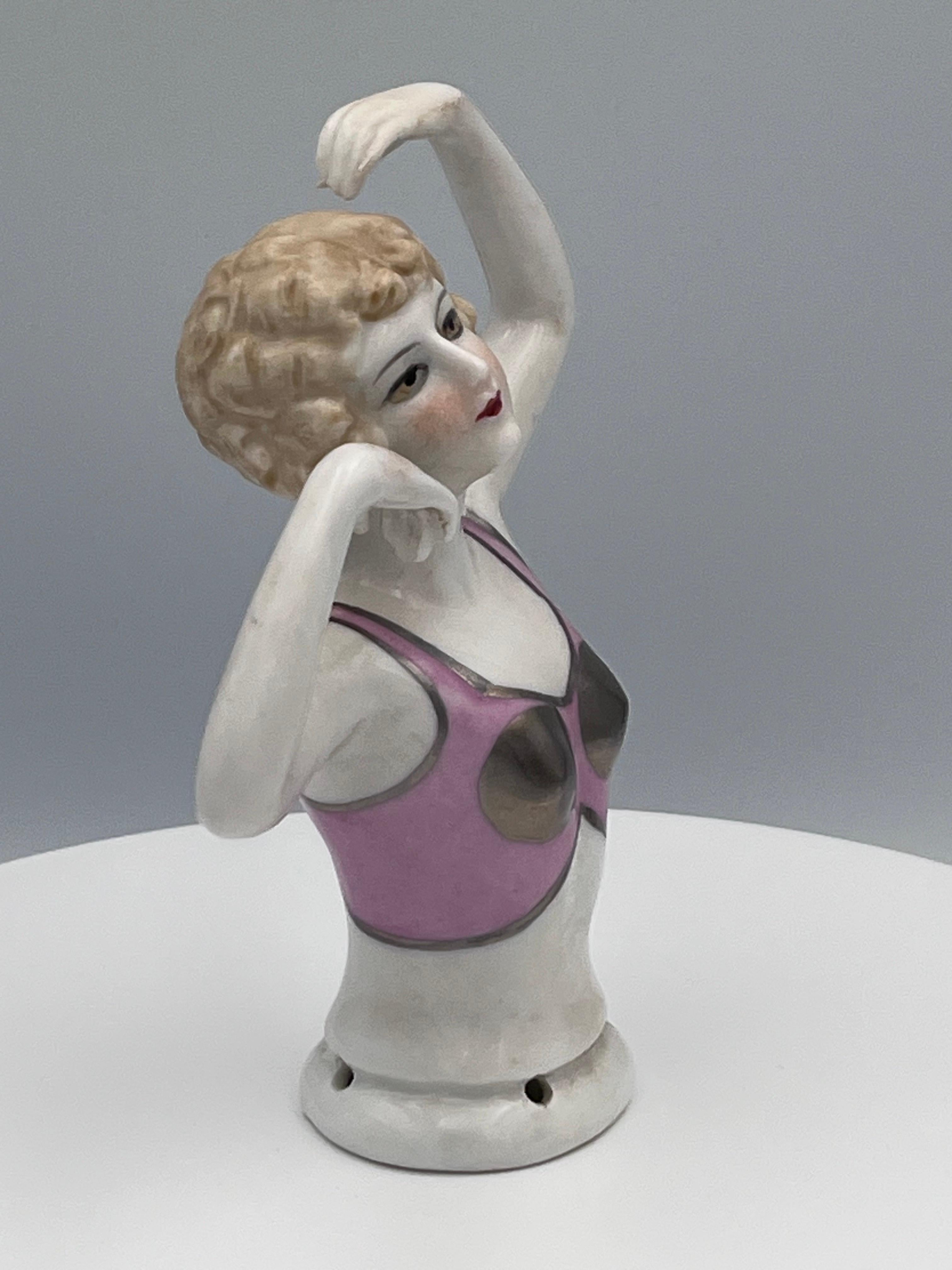 Large 1920s Art Deco Porcelain Half Doll, Flapper with Exotic Metallic Bustier

This rare and striking early 20th century porcelain half-doll embodies the glamour, boldness, and playful sophistication of the Jazz Age. Measuring a substantial 5