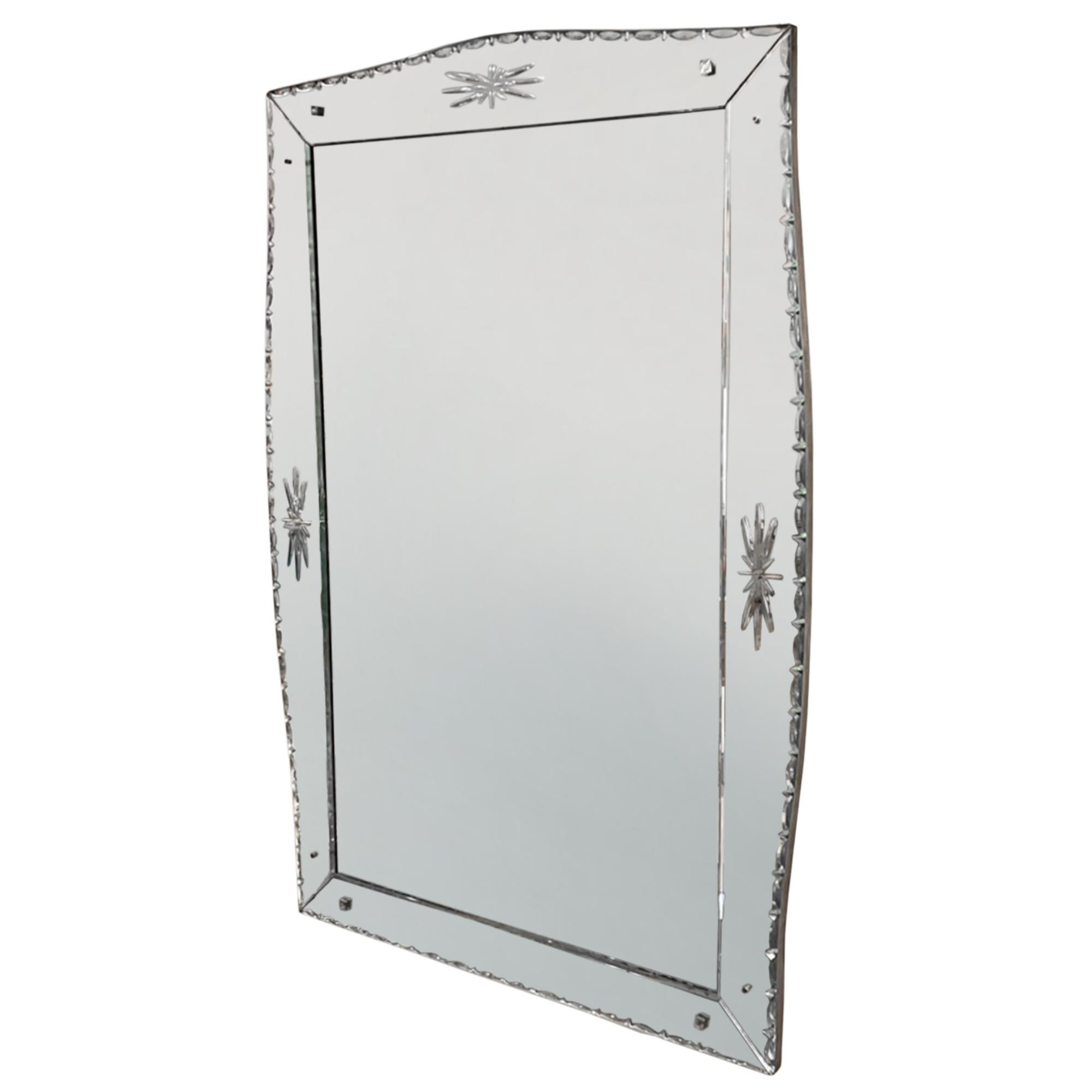 This is an elegant large mirror with a simple design in the Venetian style. Decorated with stars and a bevelled border. 

Made in France in the 1920s.

Decorative and practical - a lovely French antique for a large reception room, bedroom or