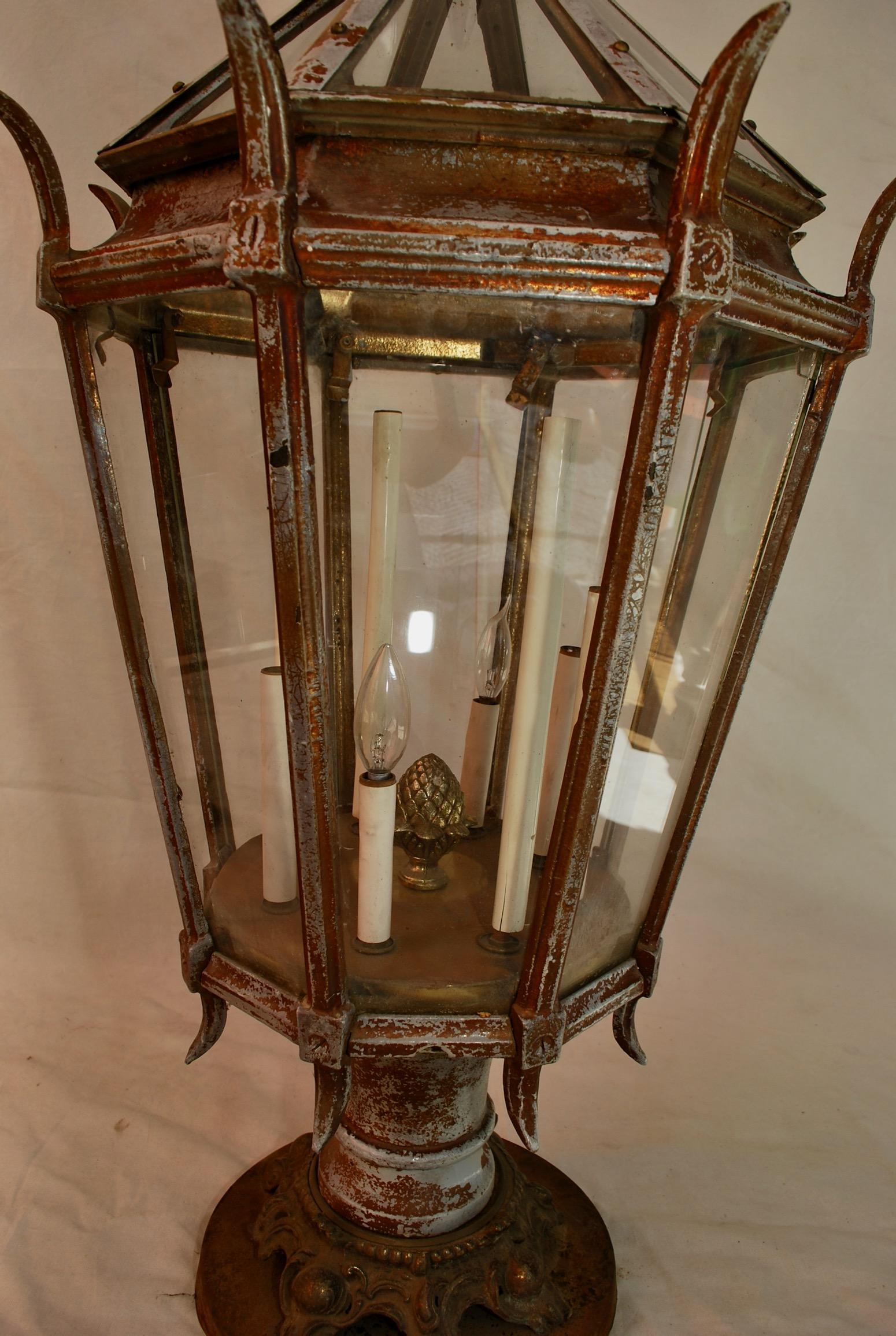 A very large post light, the color can be change, it is quite solid 1920s heavy cast iron, it take two people to transport it.

  